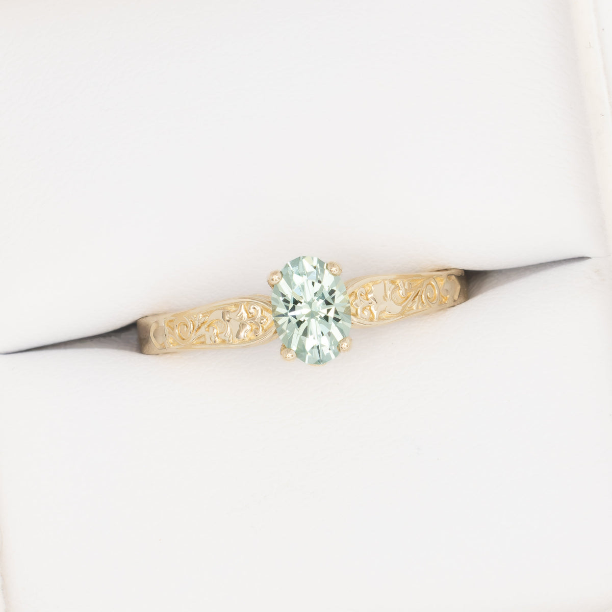 flora nature inspired ring in yellow gold with light green lab sapphire oval