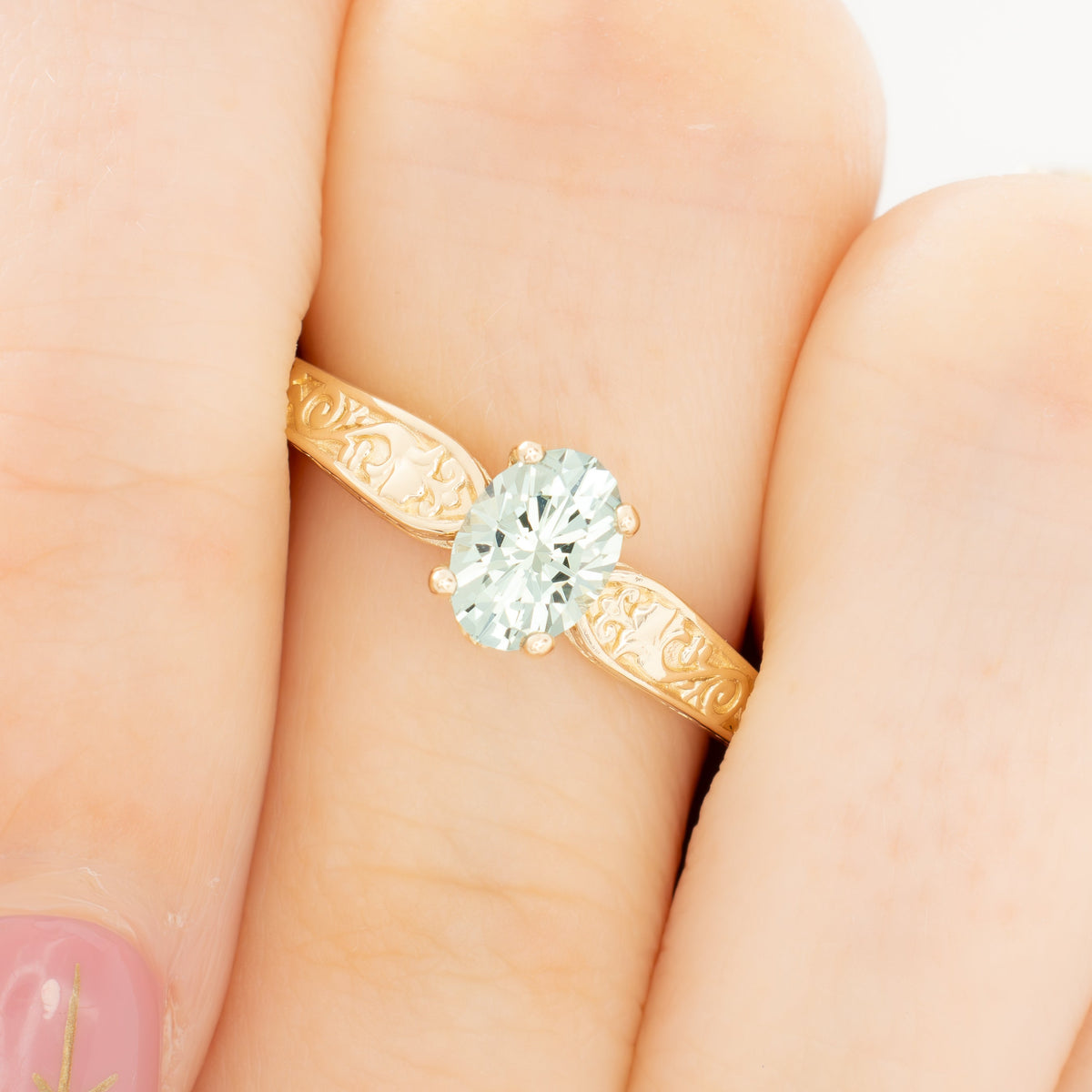 flora nature inspired ring in yellow gold with light green lab sapphire oval