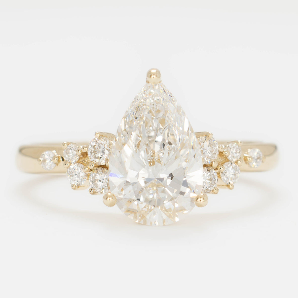 freja accented engagement ring in yellow gold with pear lab diamond