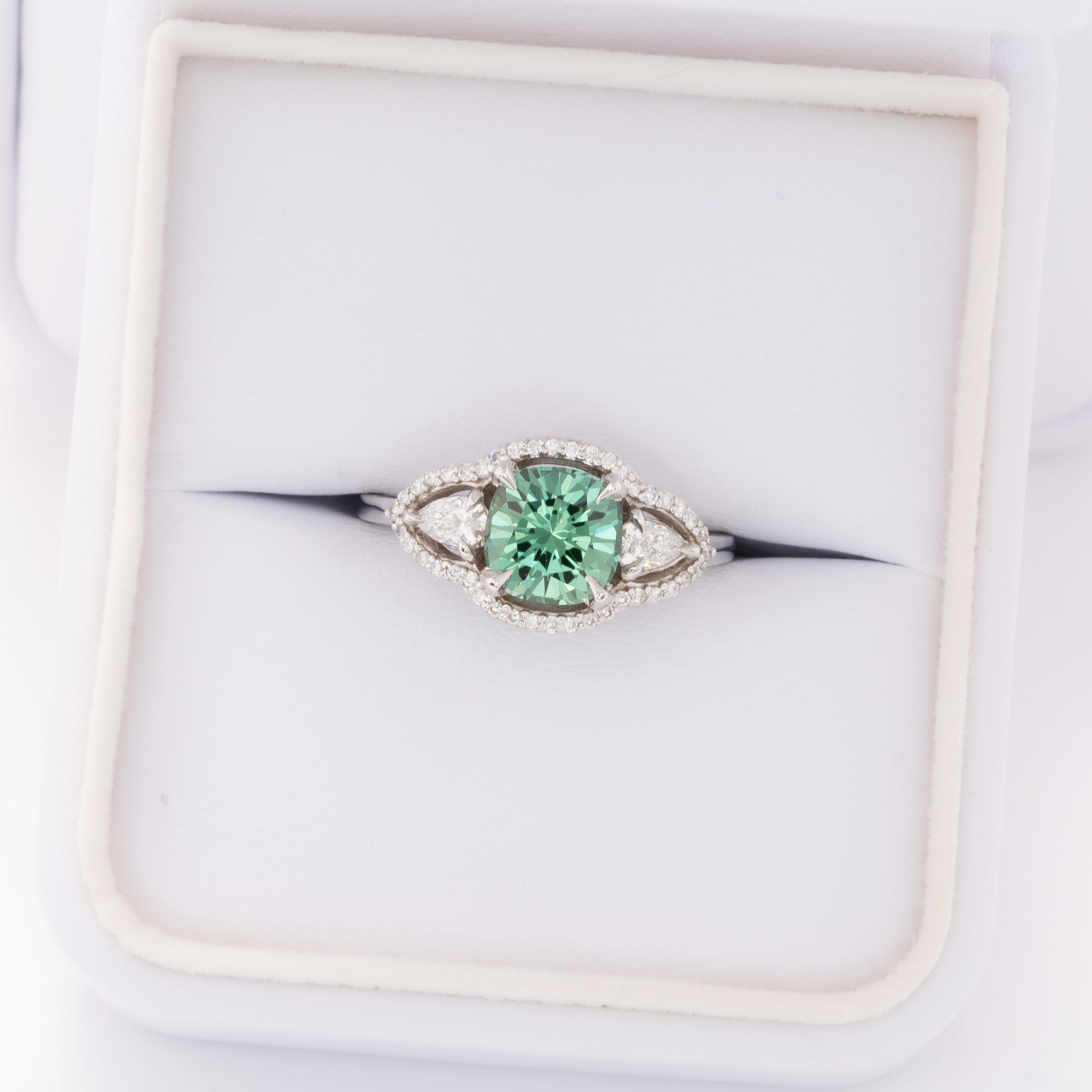 gayle three stone halo engagement ring with cushion green lab sapphire