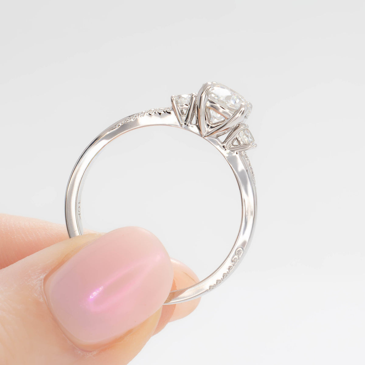giselle accented three stone ring in white gold with round lab diamond