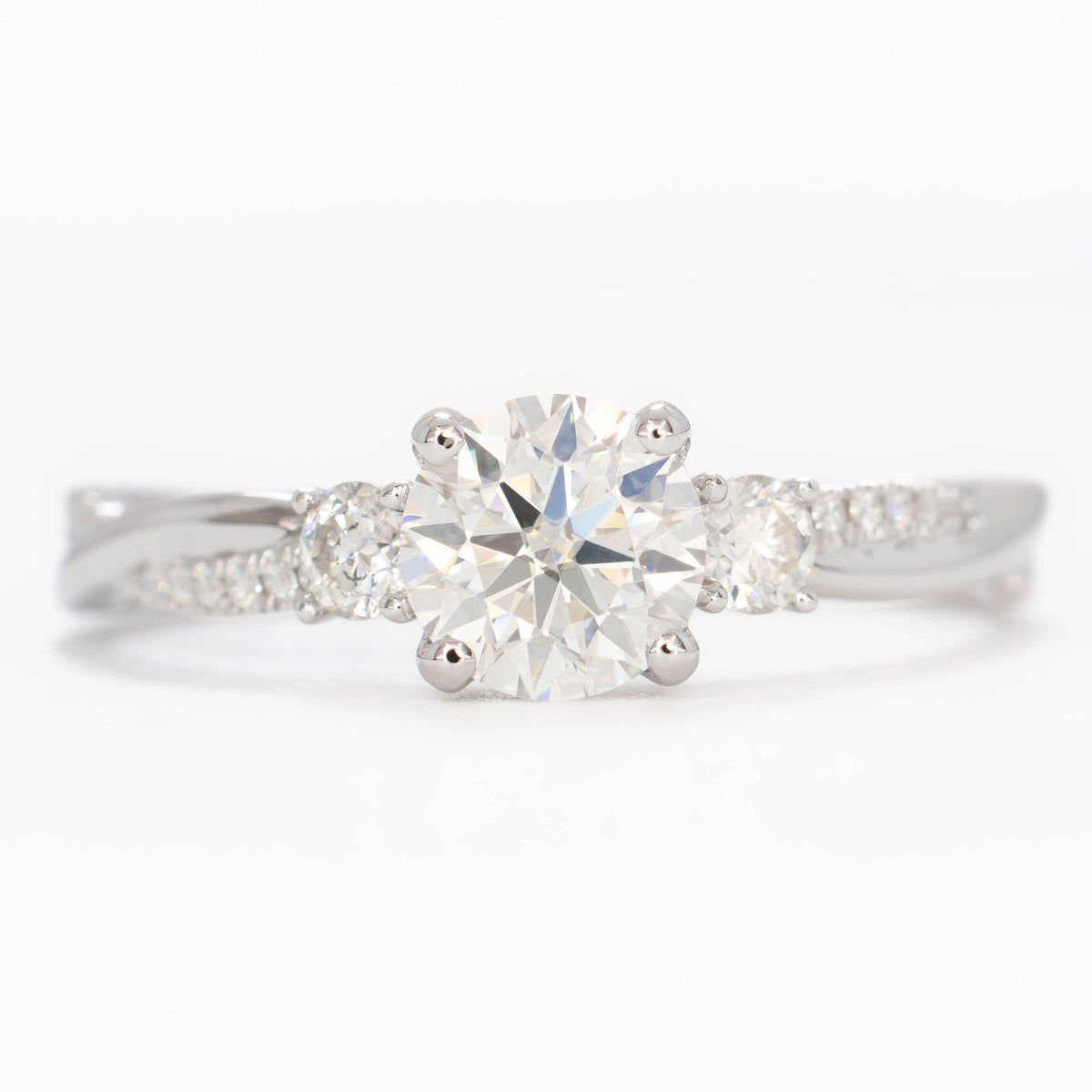 giselle accented three stone ring in white gold with round lab diamond