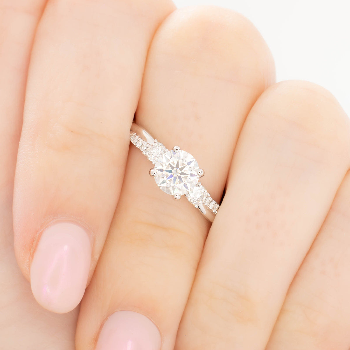 giselle accented three stone ring in white gold with round lab diamond