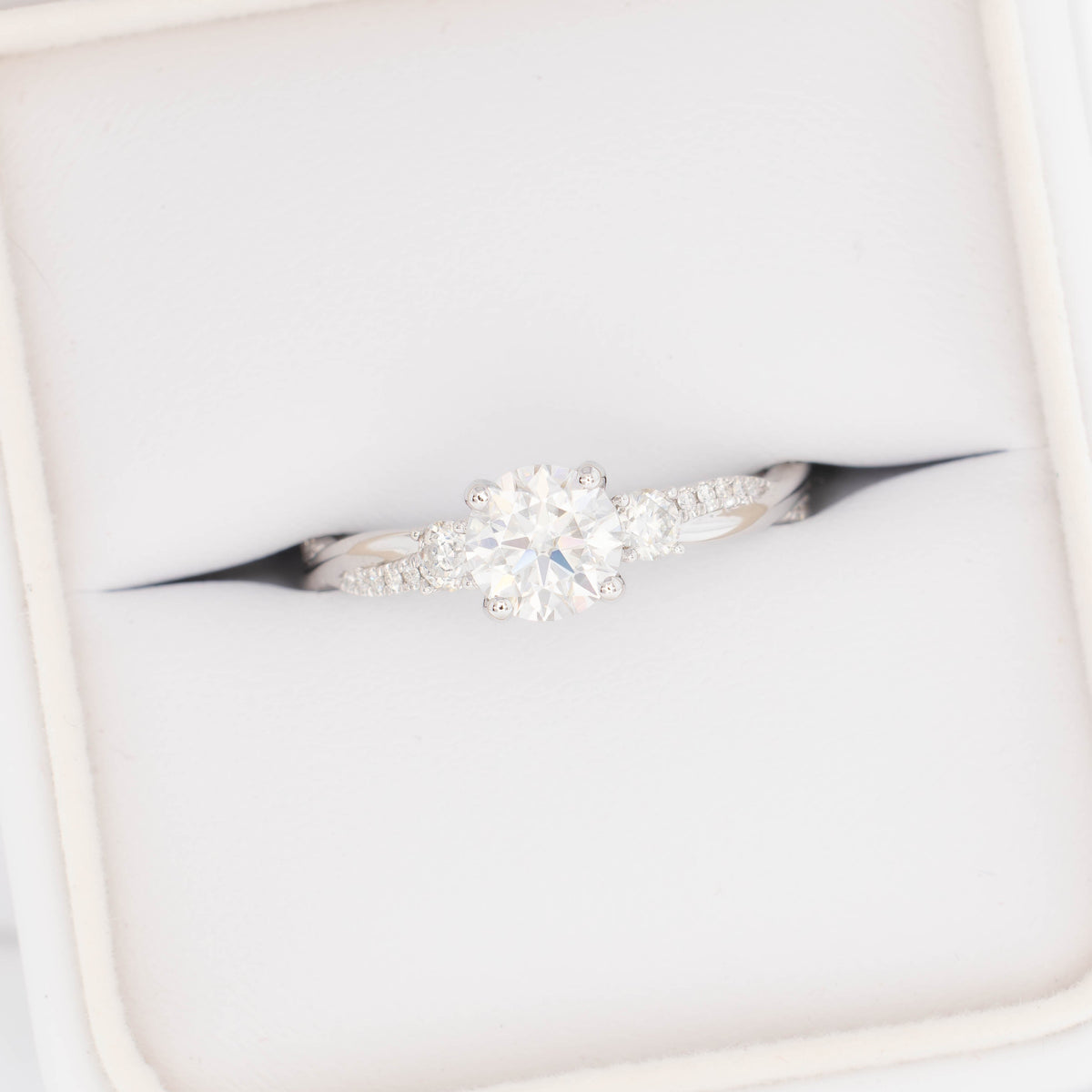 giselle accented three stone ring in white gold with round lab diamond