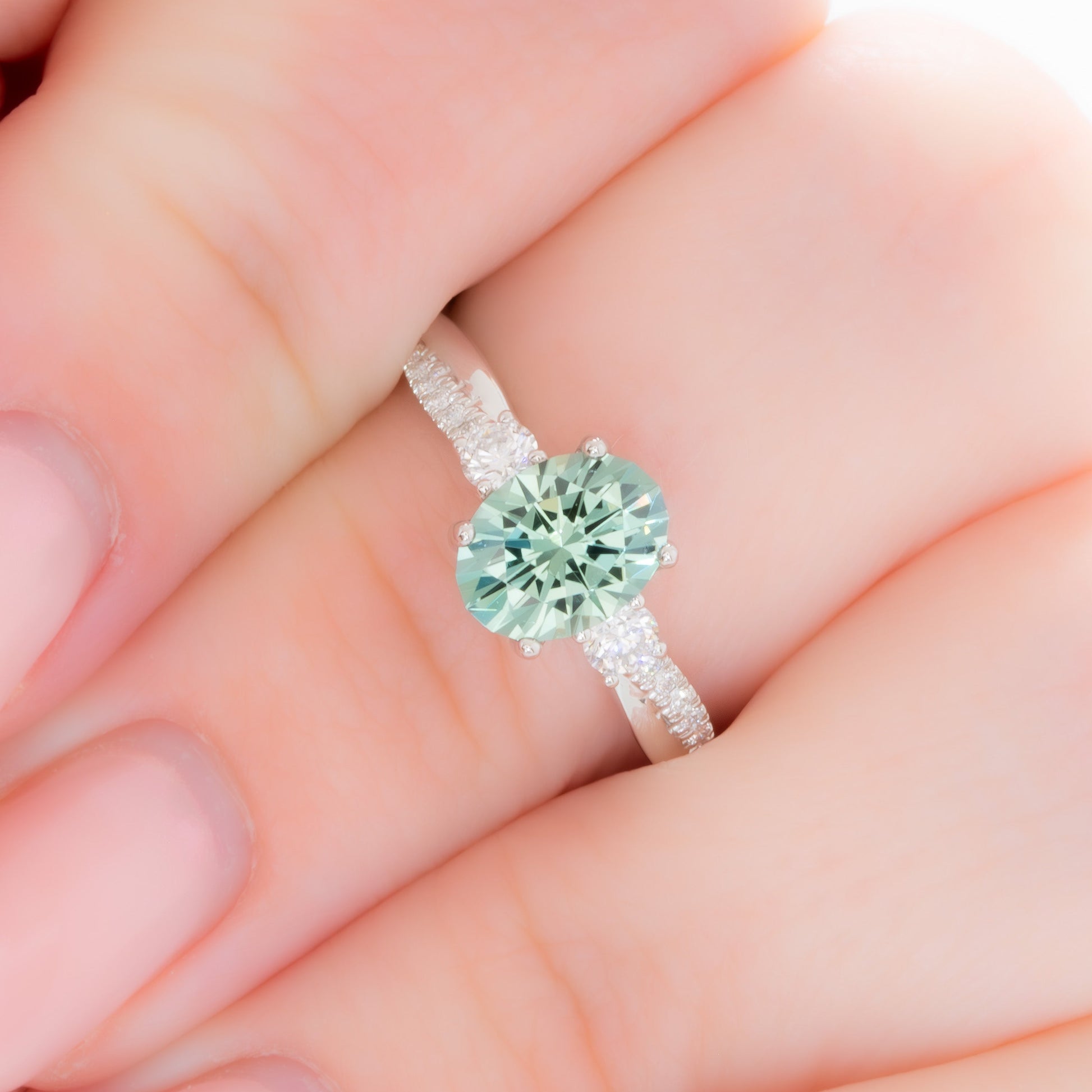 giselle three stone ring with oval green lab sapphire