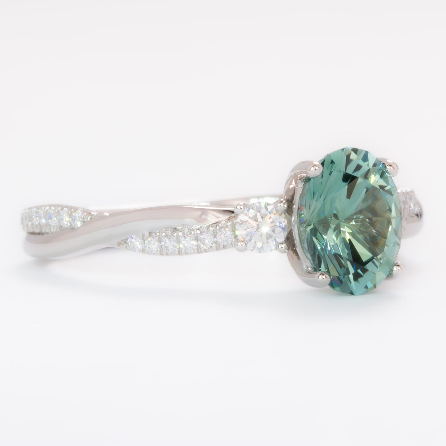 giselle three stone ring with oval green lab sapphire