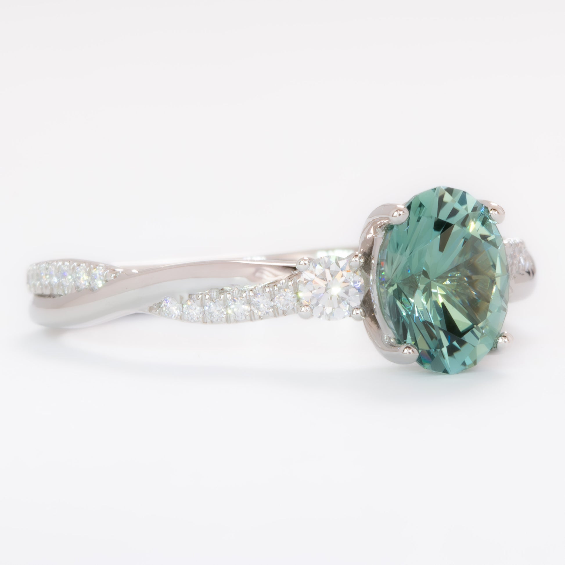 giselle three stone ring with oval green lab sapphire