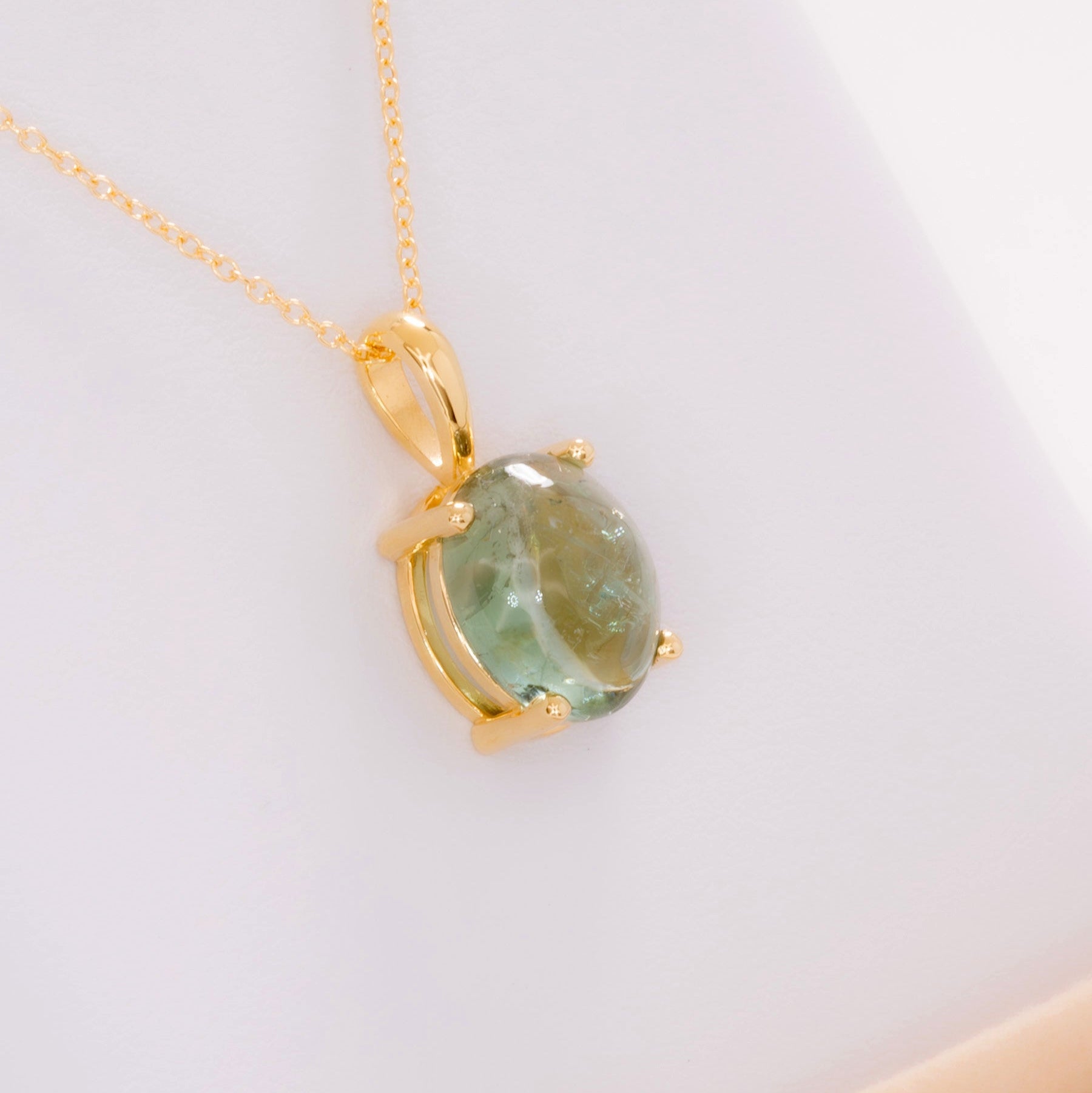 green tourmaline oval cabochon necklace in yellow gold