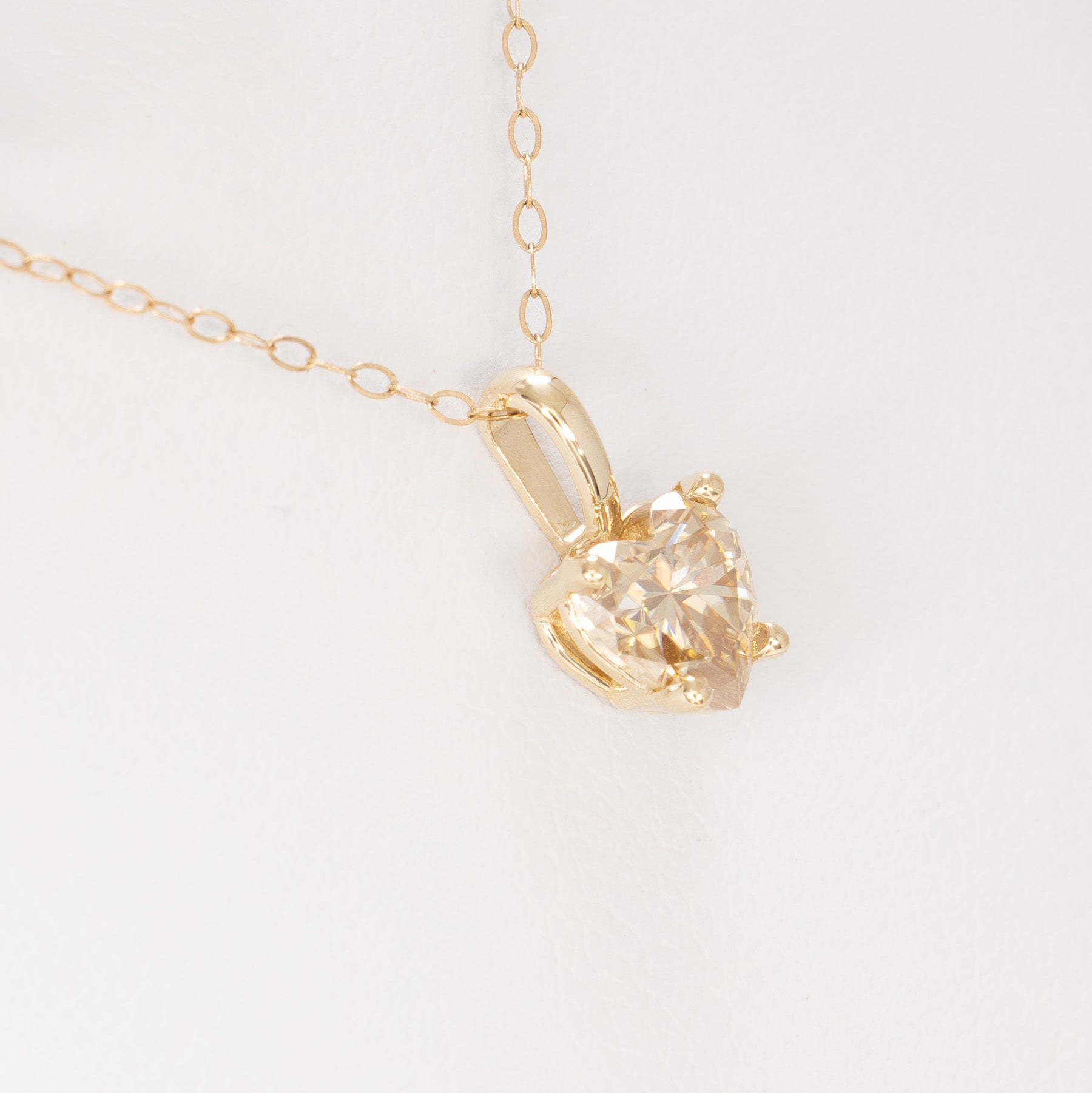 heart necklace in yellow gold with heart champagne moissanite