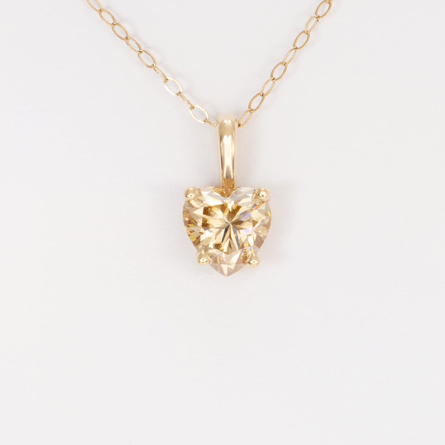 heart necklace in yellow gold with heart champagne moissanite