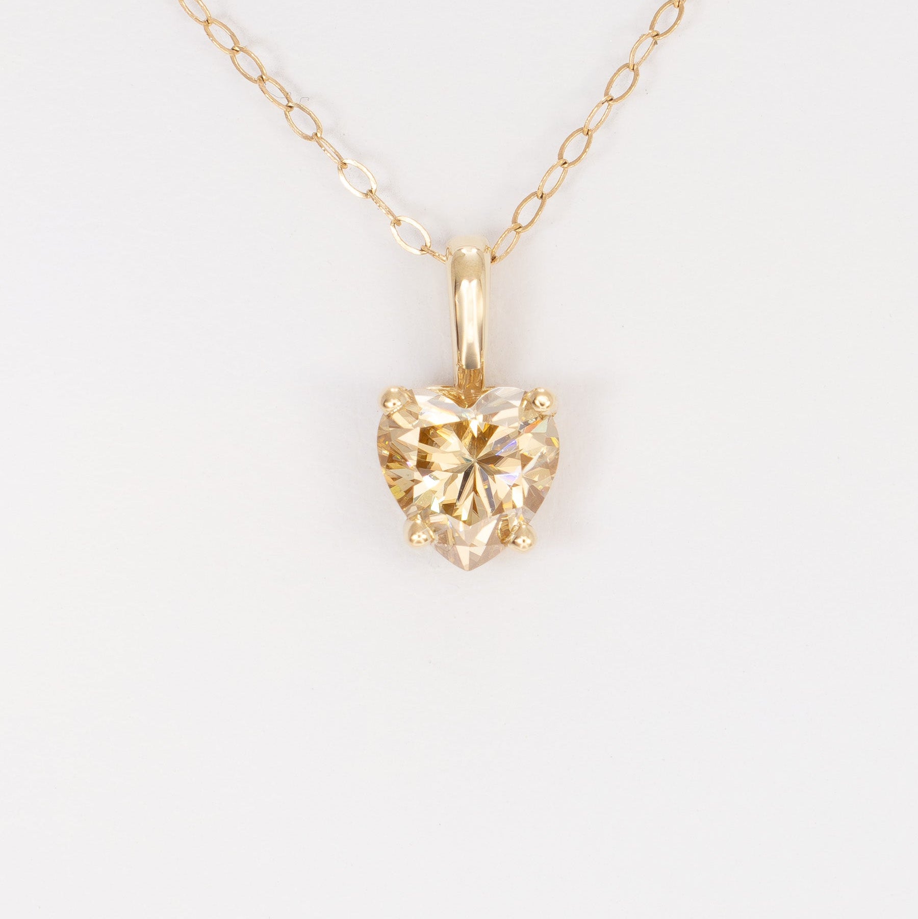 heart necklace in yellow gold with heart champagne moissanite