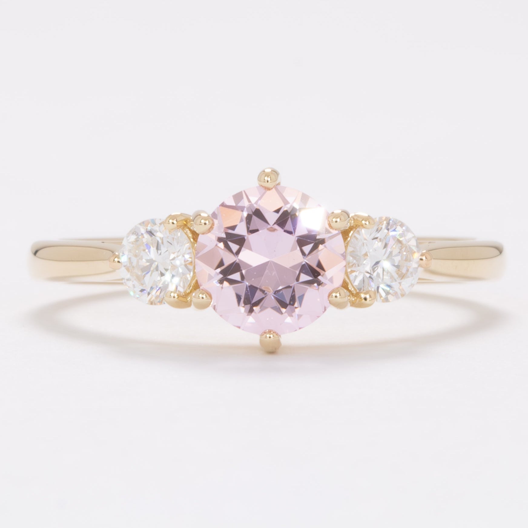 inara three stone engagement ring with pink lab sapphire
