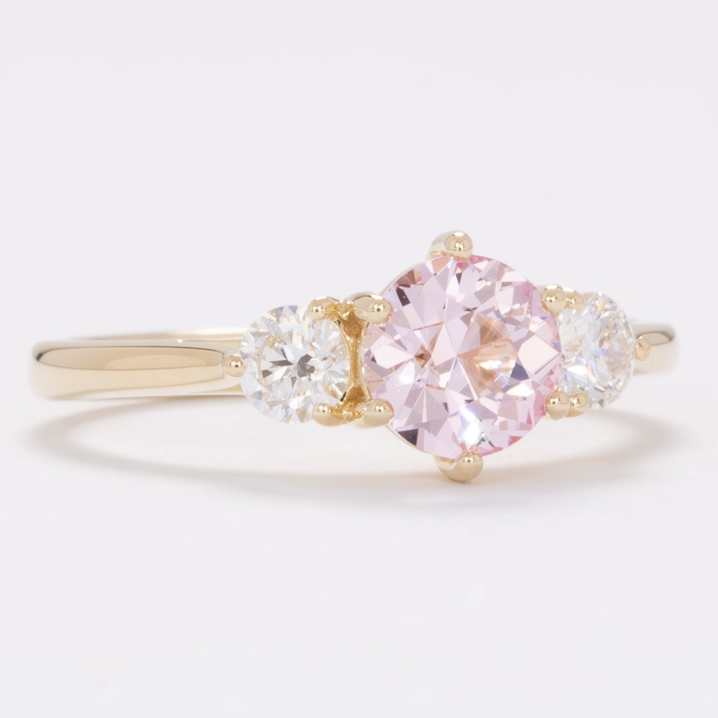 inara three stone engagement ring with pink lab sapphire