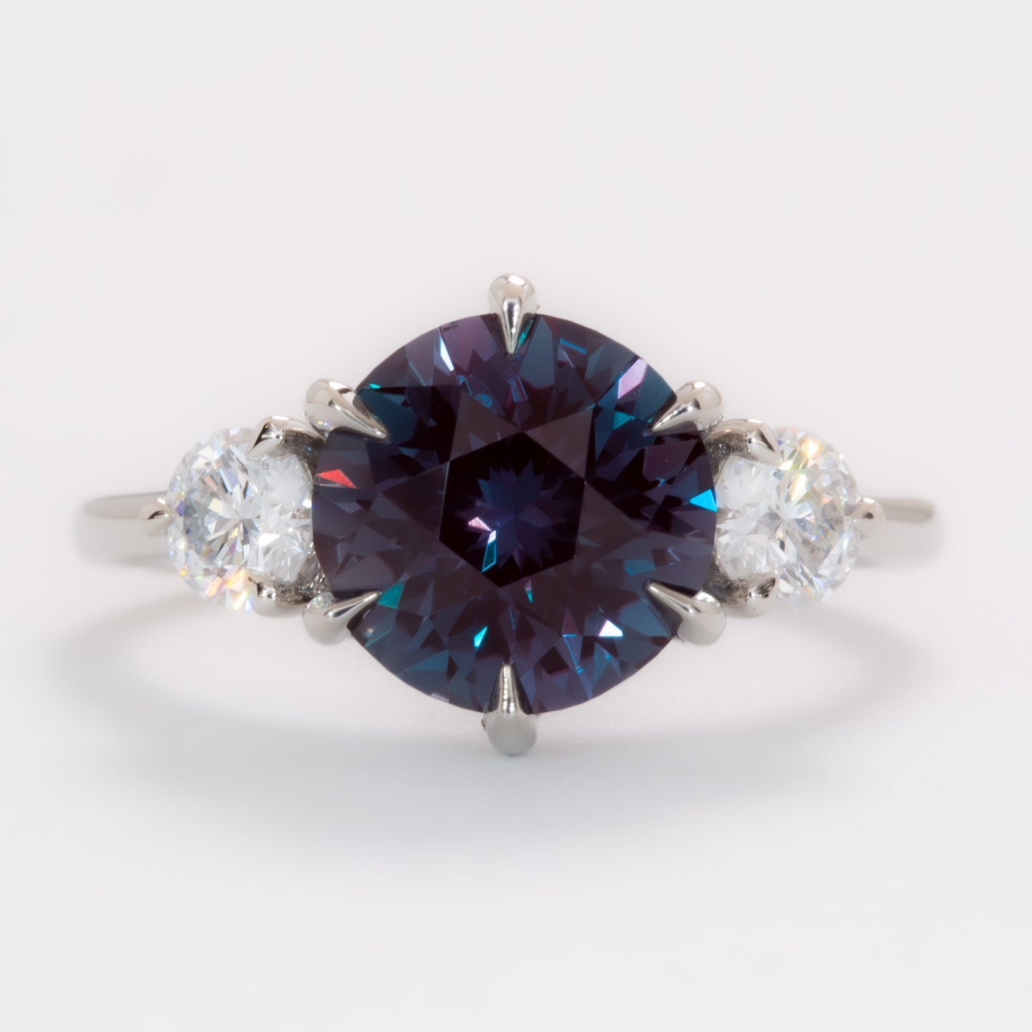 inara three stone engagement ring with round lab alexandrite