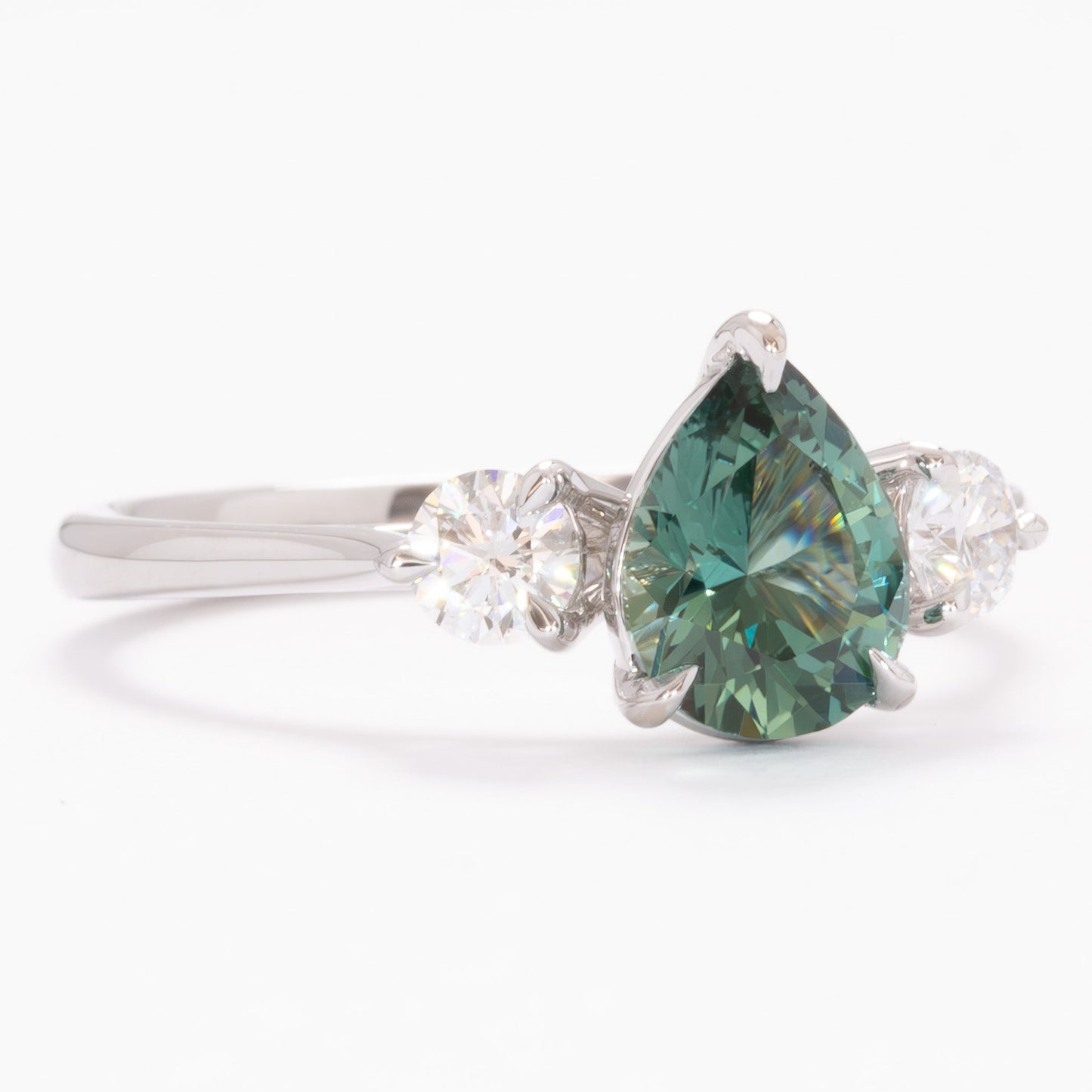 inara three stone ring in white gold with pear green lab sapphire