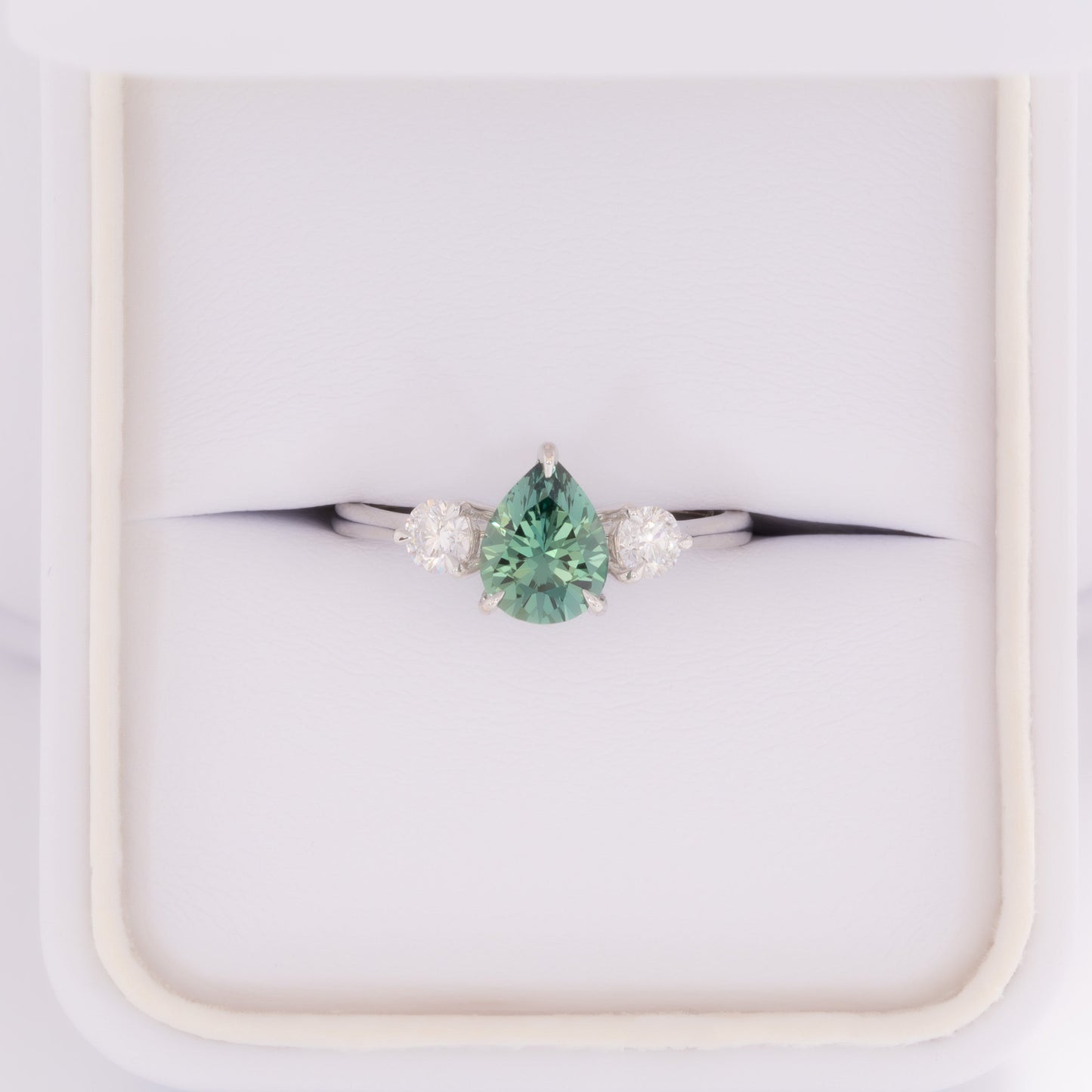 inara three stone ring in white gold with pear green lab sapphire