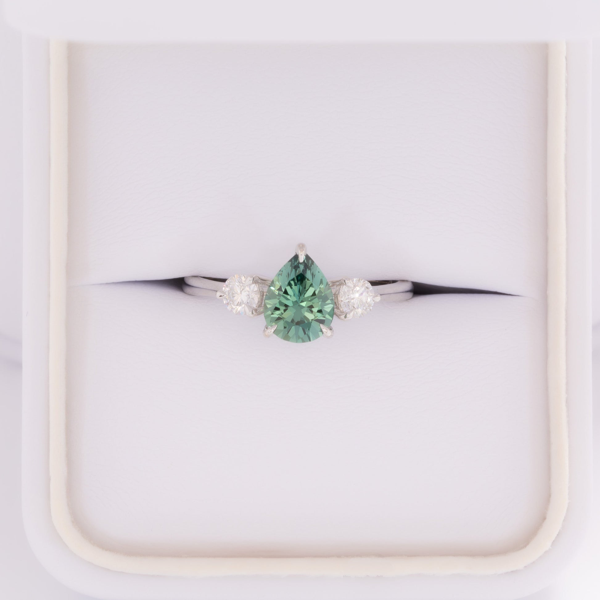 inara three stone ring in white gold with pear green lab sapphire