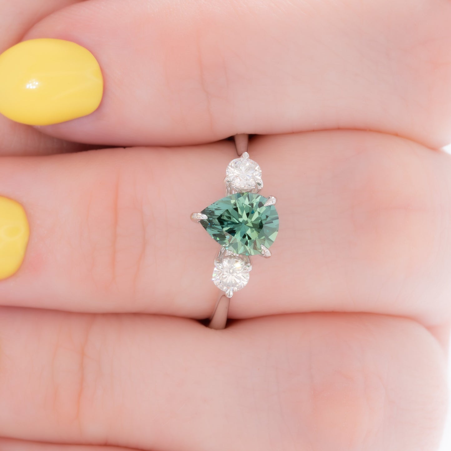 inara three stone ring in white gold with pear green lab sapphire
