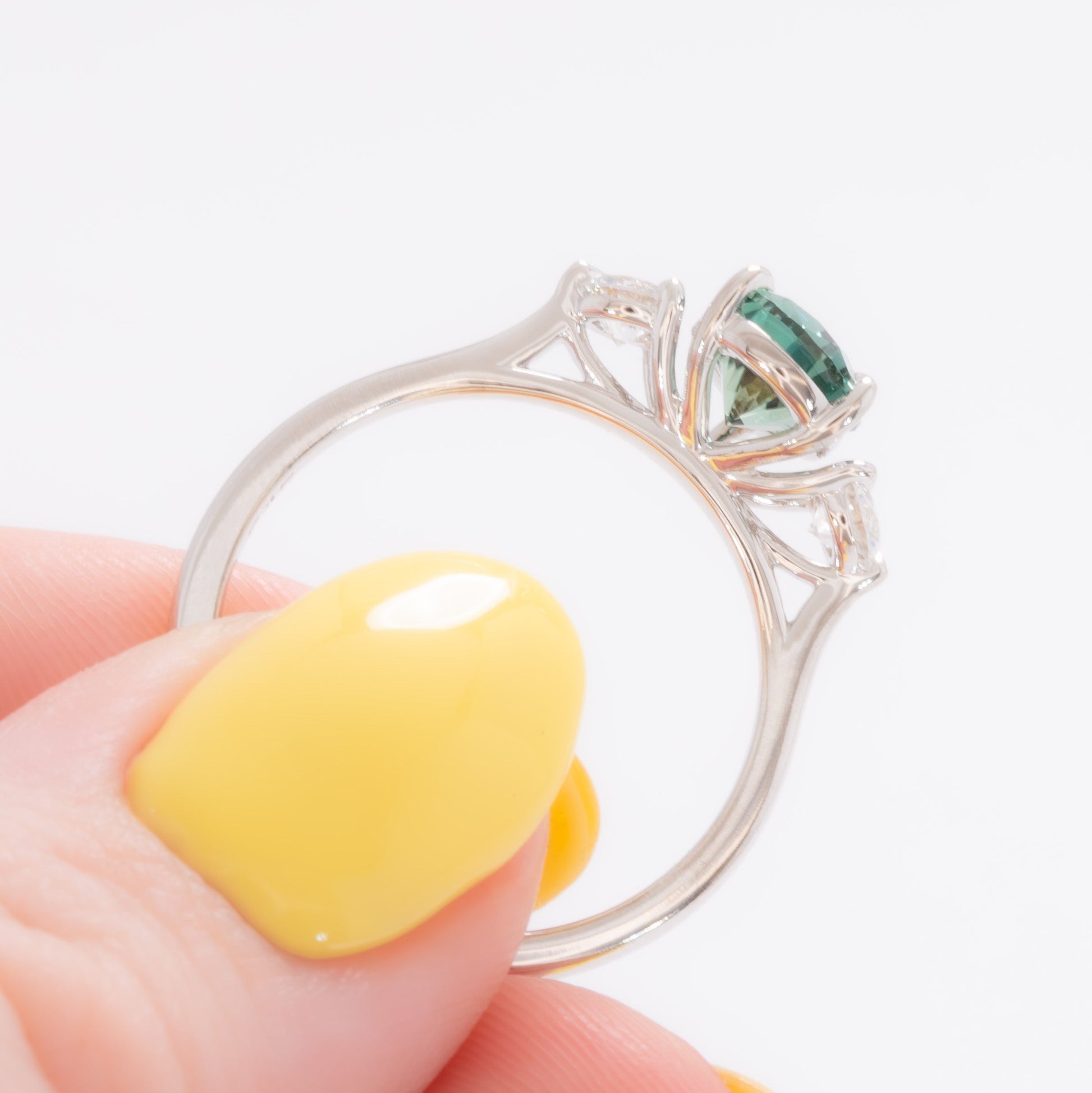 inara three stone ring in white gold with pear green lab sapphire
