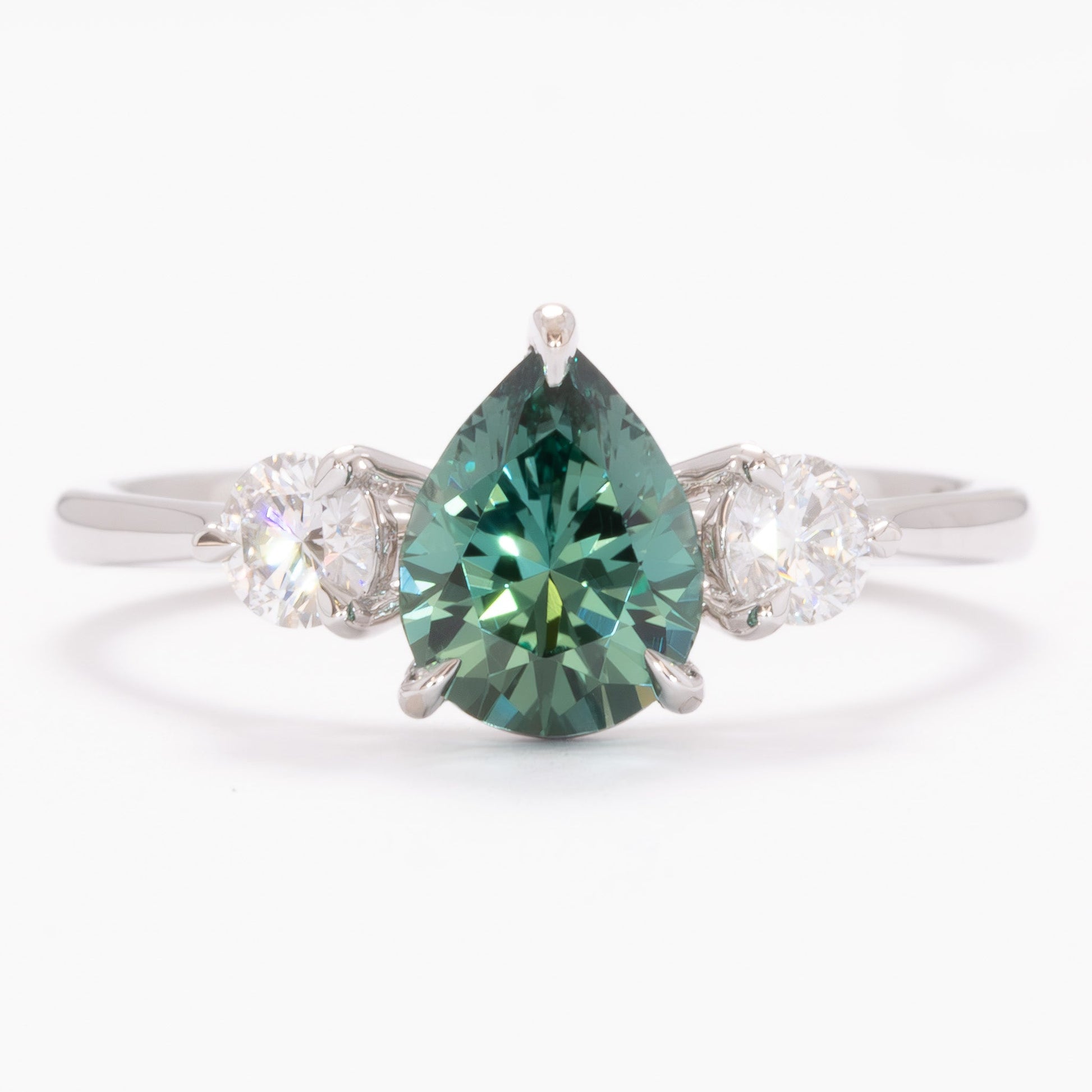 inara three stone ring in white gold with pear green lab sapphire