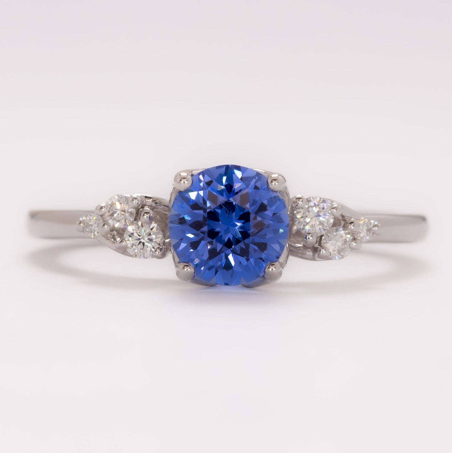 isla engagement ring with round blue lab sapphire