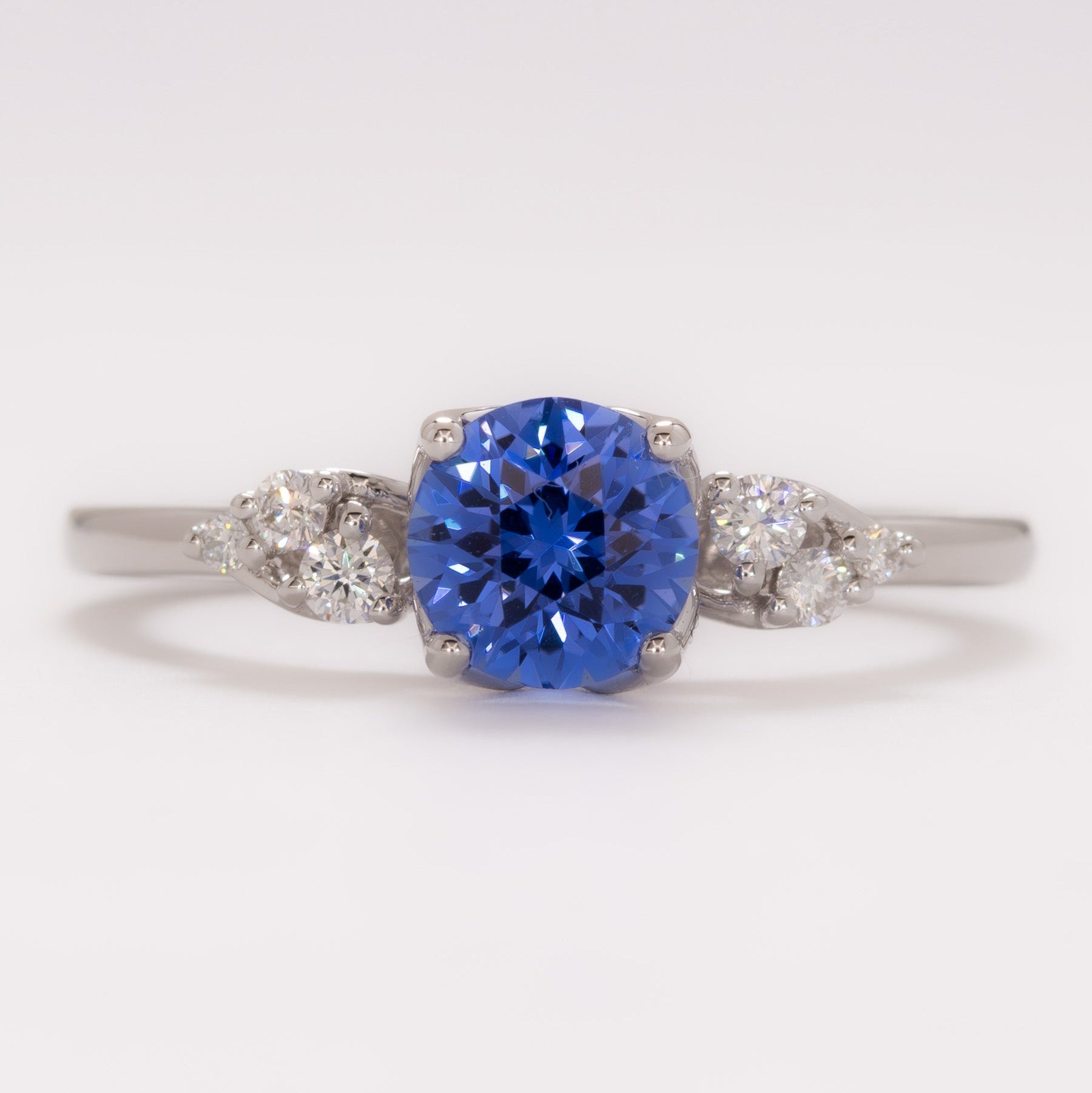 isla engagement ring with round blue lab sapphire