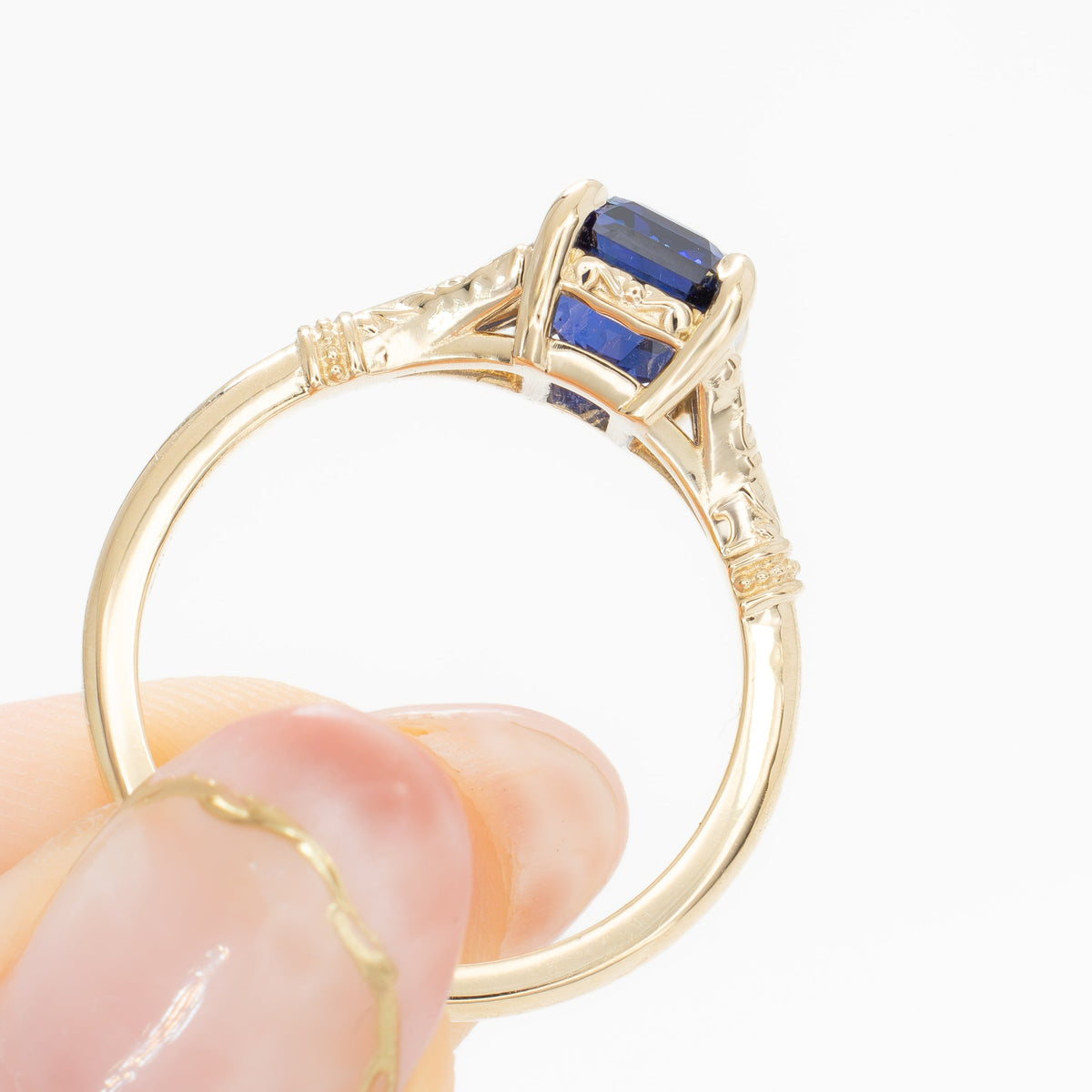 jasmine split shank solitaire ring in yellow gold with radiant royal blue lab sapphire