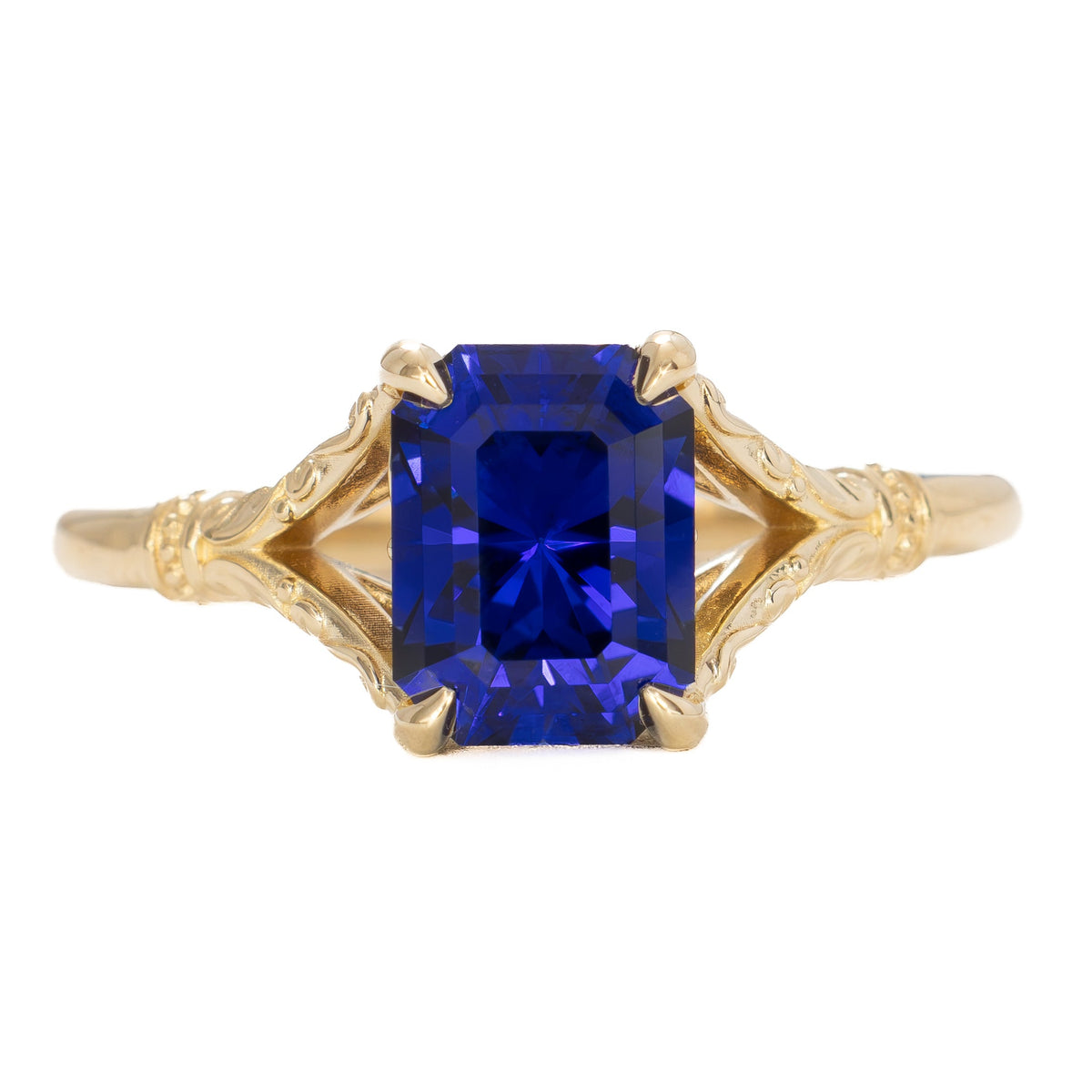 jasmine split shank solitaire ring in yellow gold with radiant royal blue lab sapphire