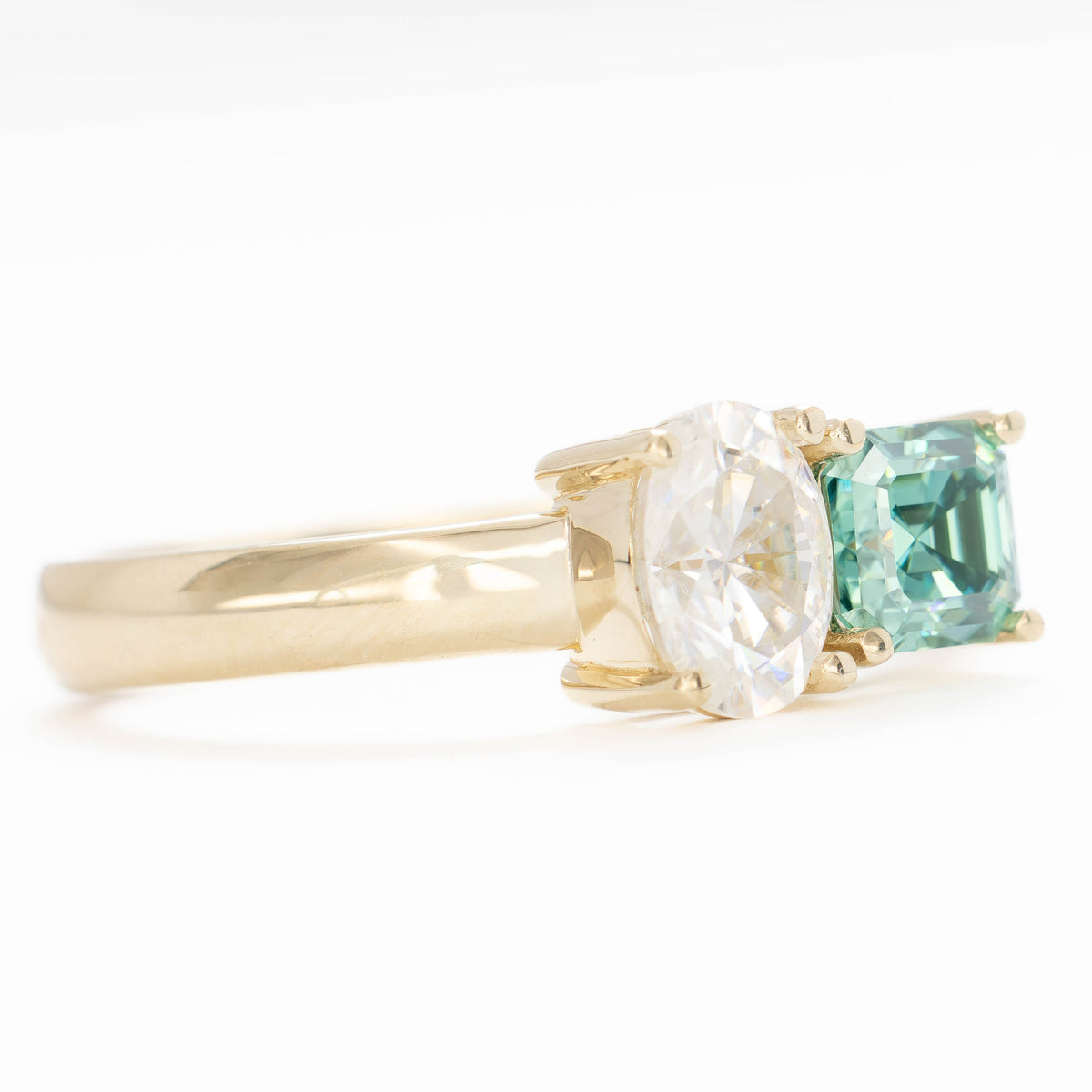 jiva toi et moi ring with oval white moissanite and asscher green moissanite