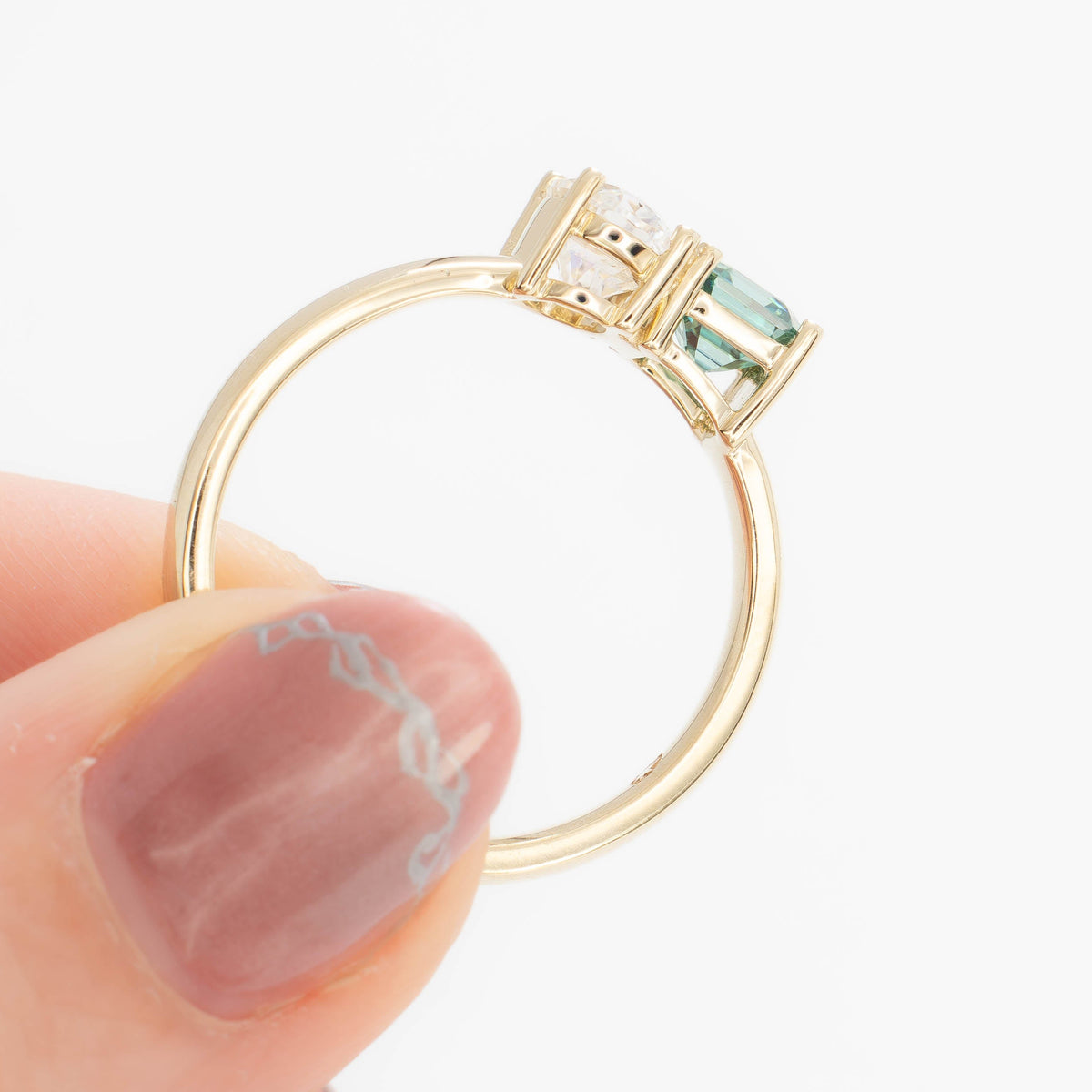 jiva toi et moi ring with oval white moissanite and asscher green moissanite