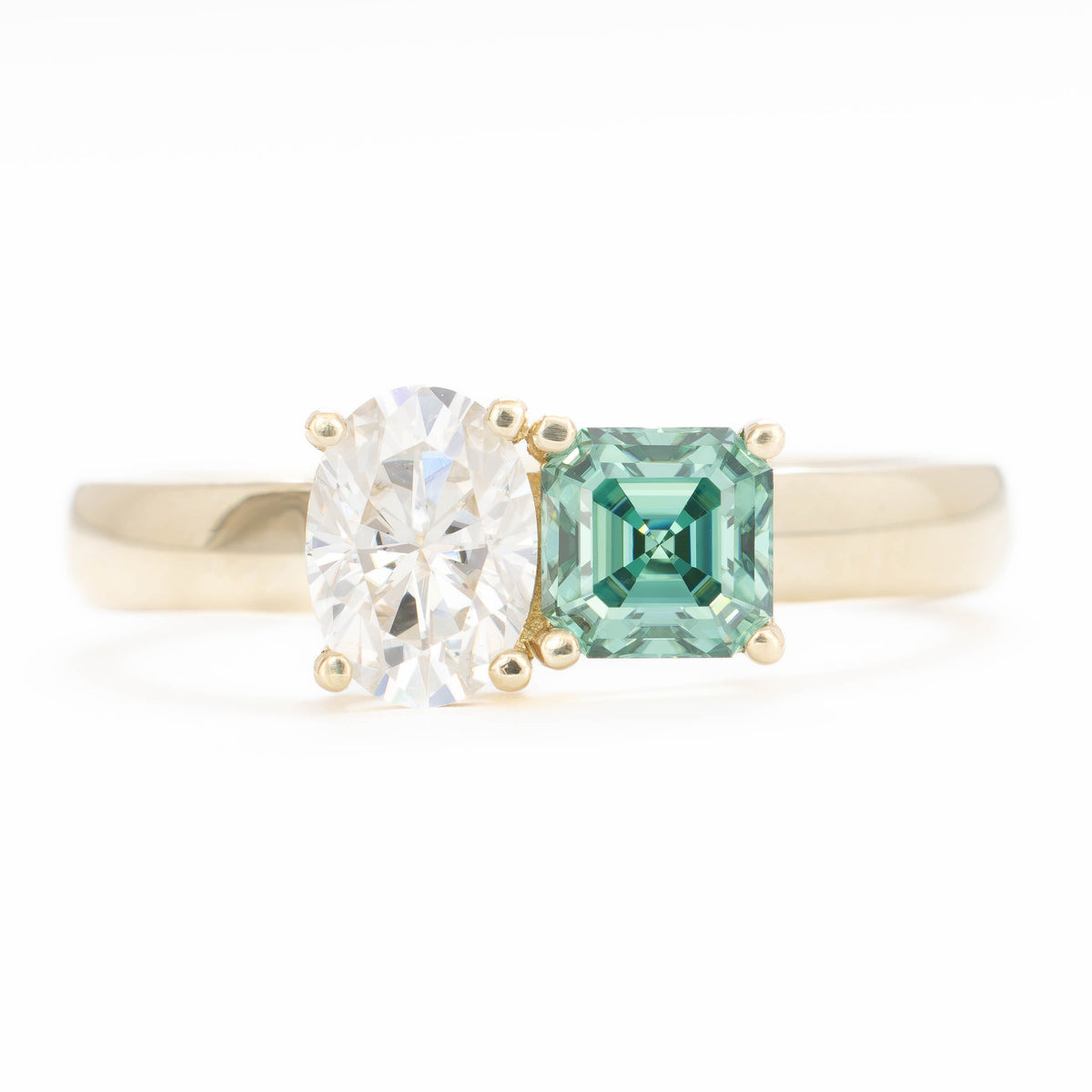 jiva toi et moi ring with oval white moissanite and asscher green moissanite