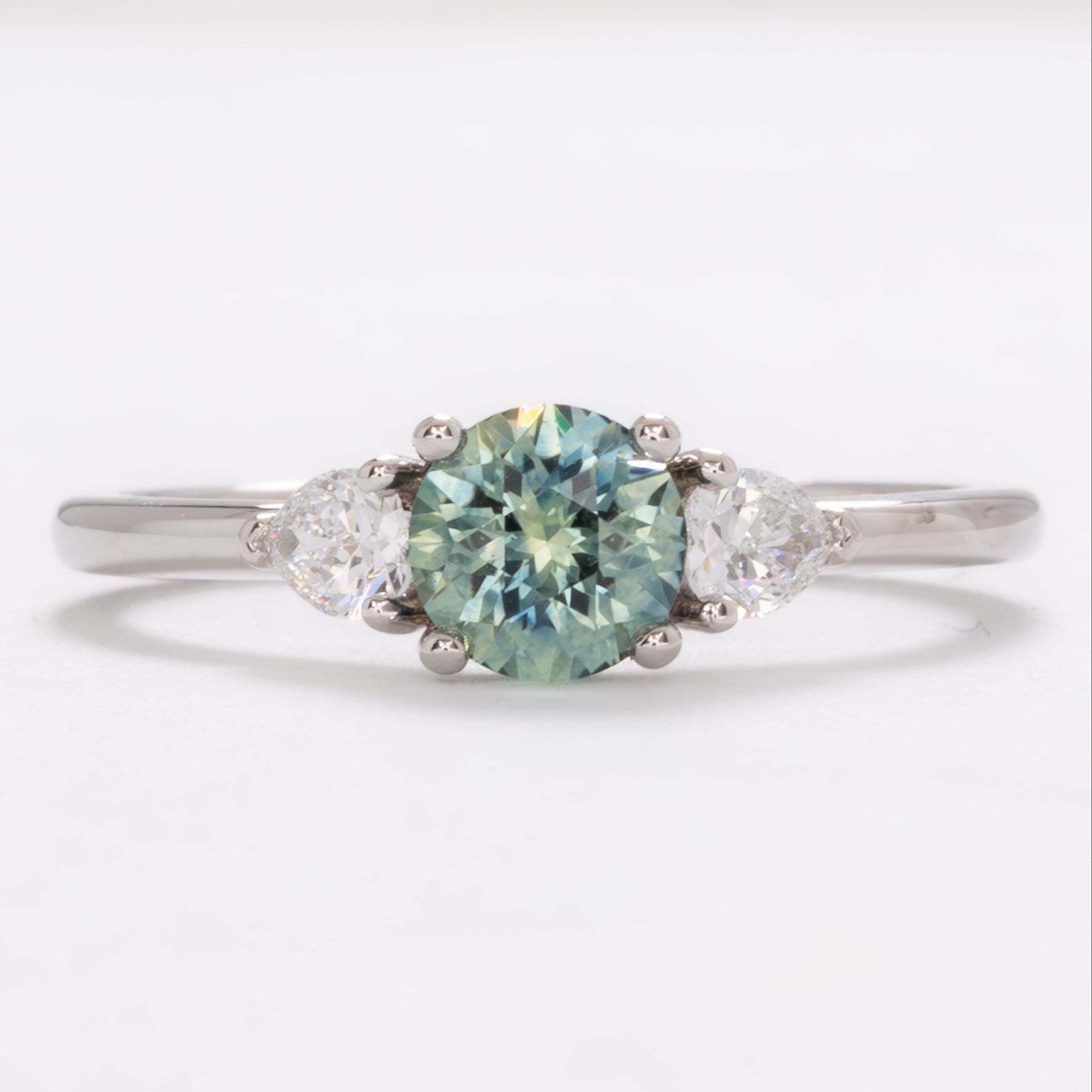 josie three stone engagement ring with round montana sapphire