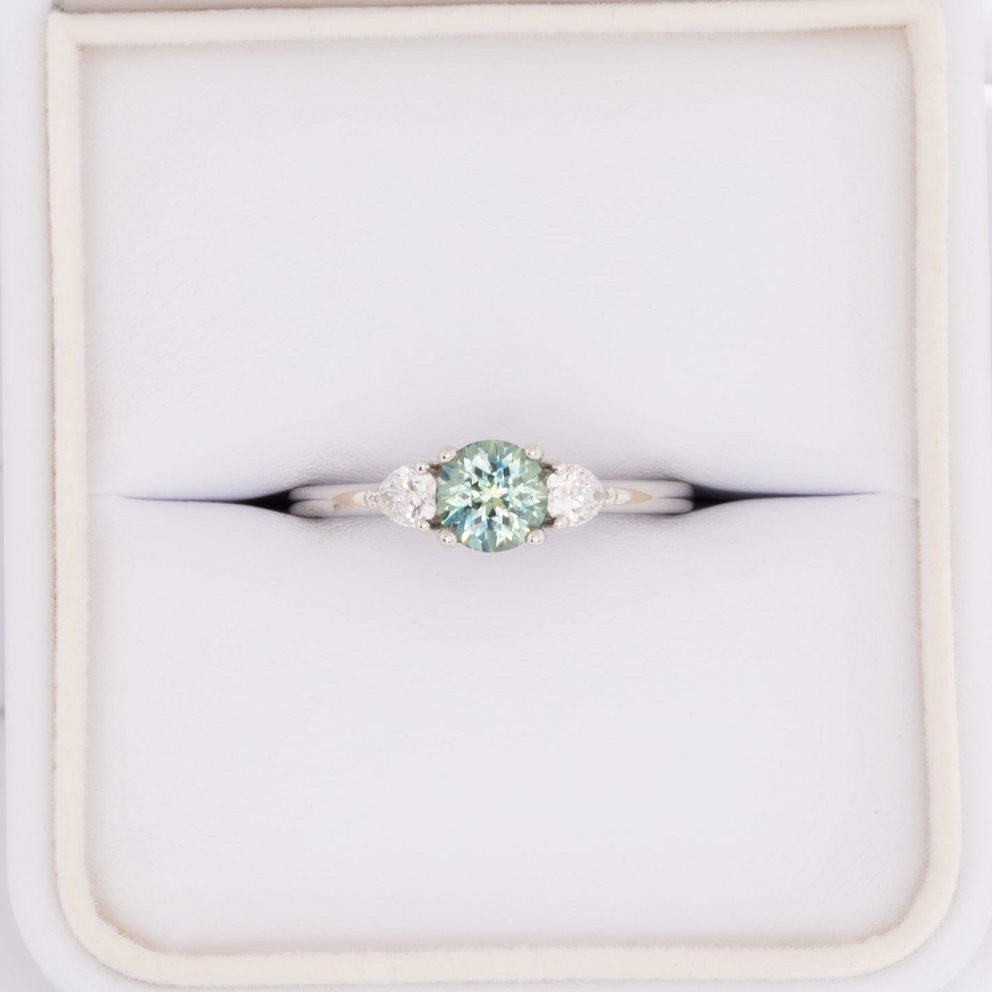 josie three stone engagement ring with round montana sapphire