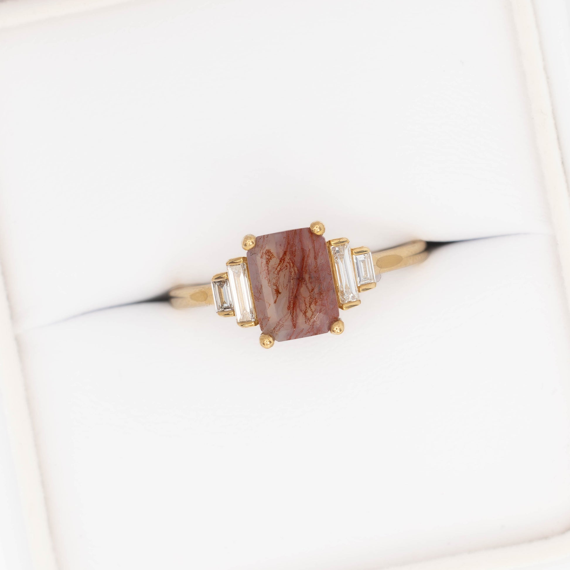 journey ring with step cut red moss agate in yellow gold