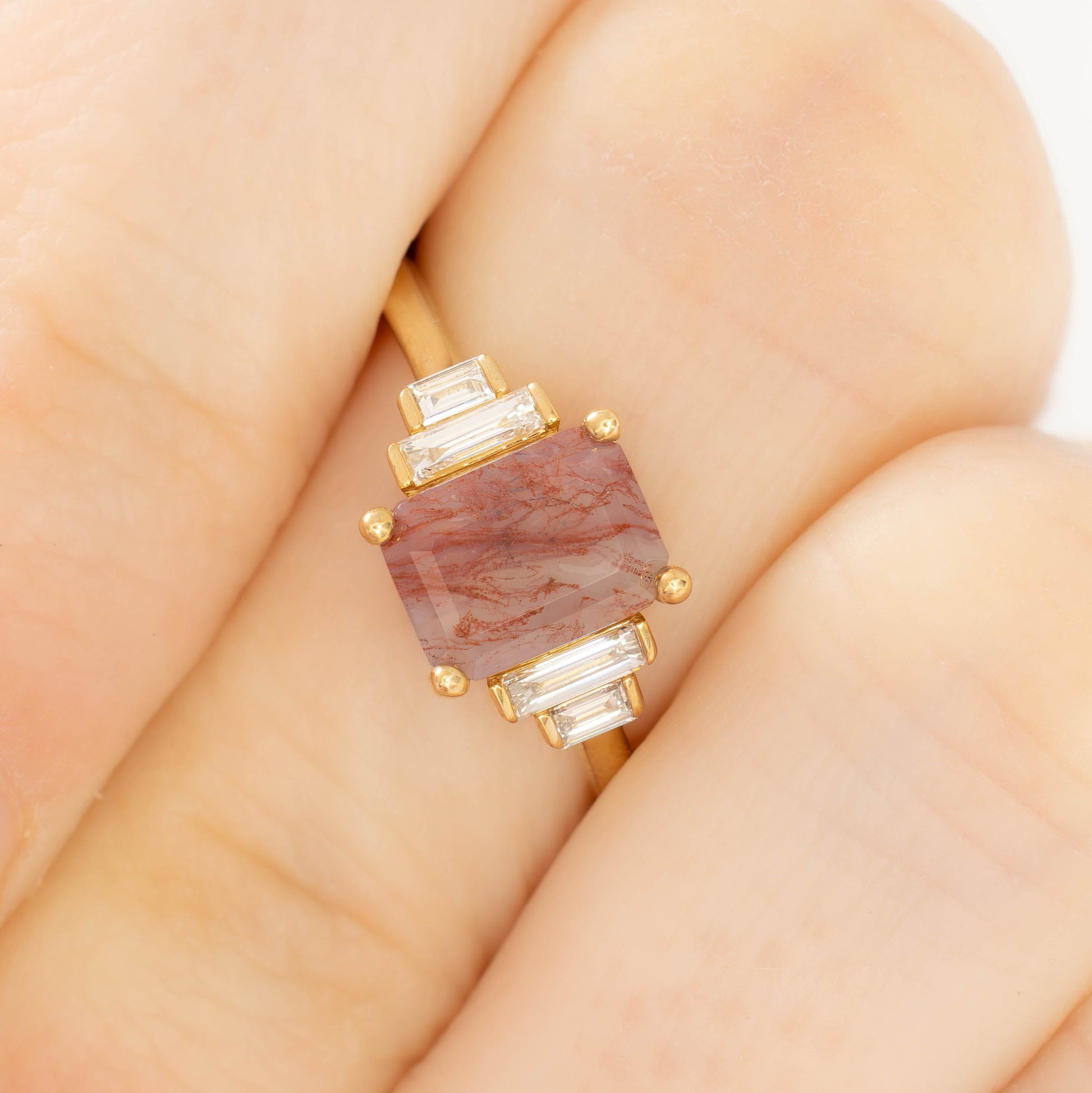 journey ring with step cut red moss agate in yellow gold