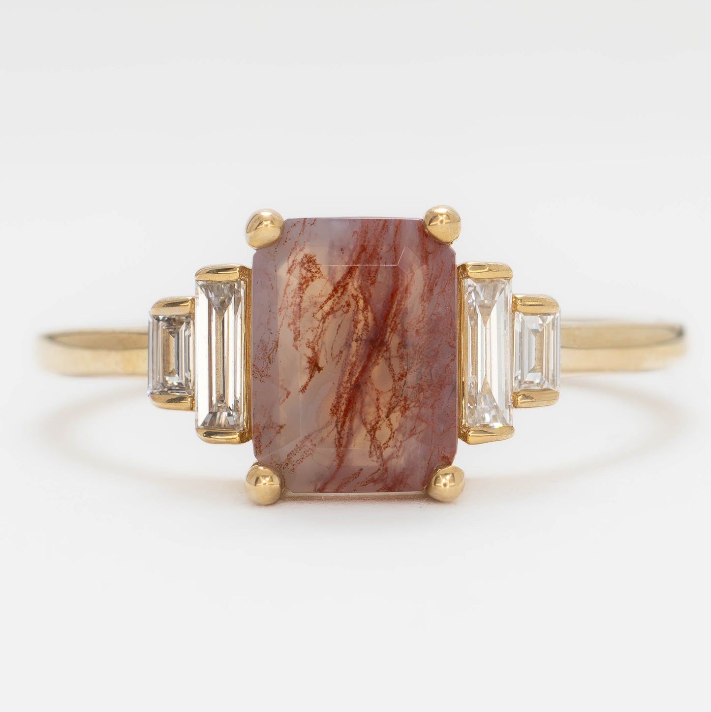 journey ring with step cut red moss agate in yellow gold