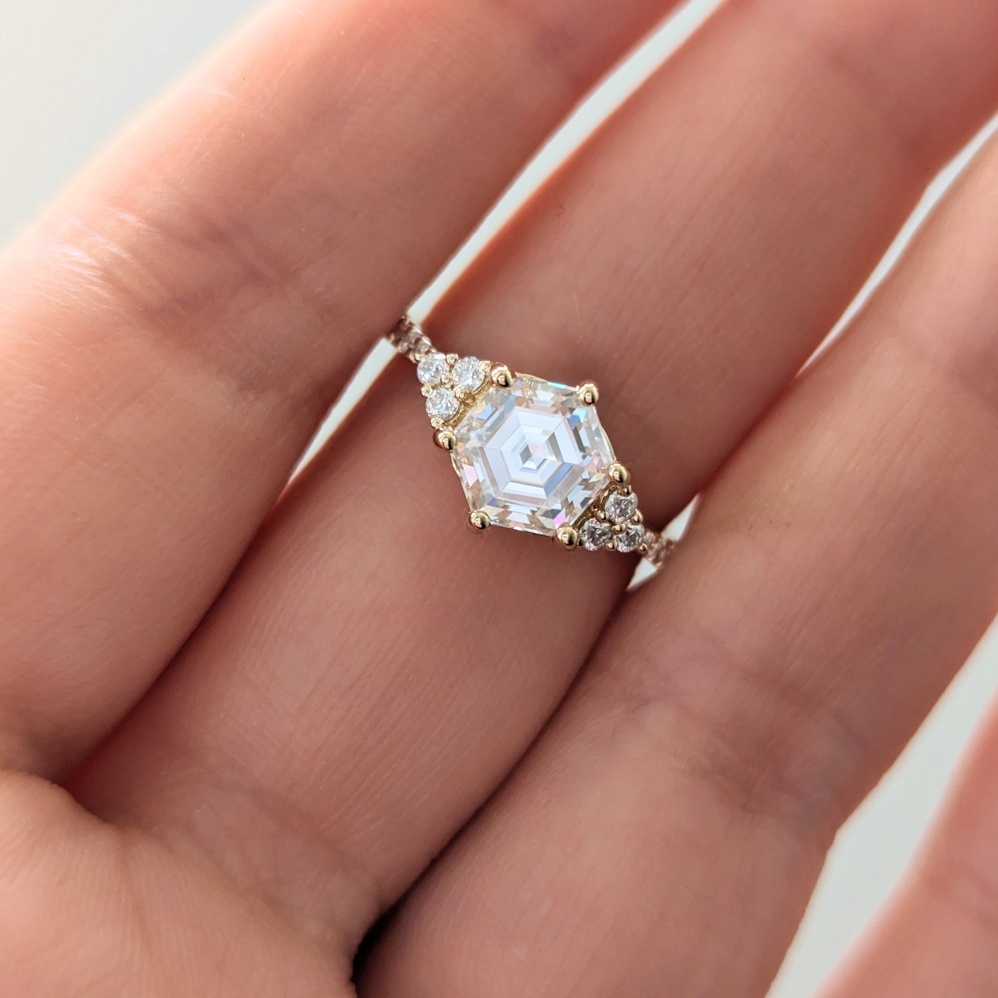 juliette engagement ring with yellow gold and hex cut moissanite 