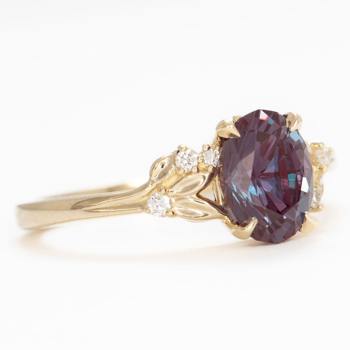 kinsley nature inspired wedding set in yellow gold with oval lab alexandrite