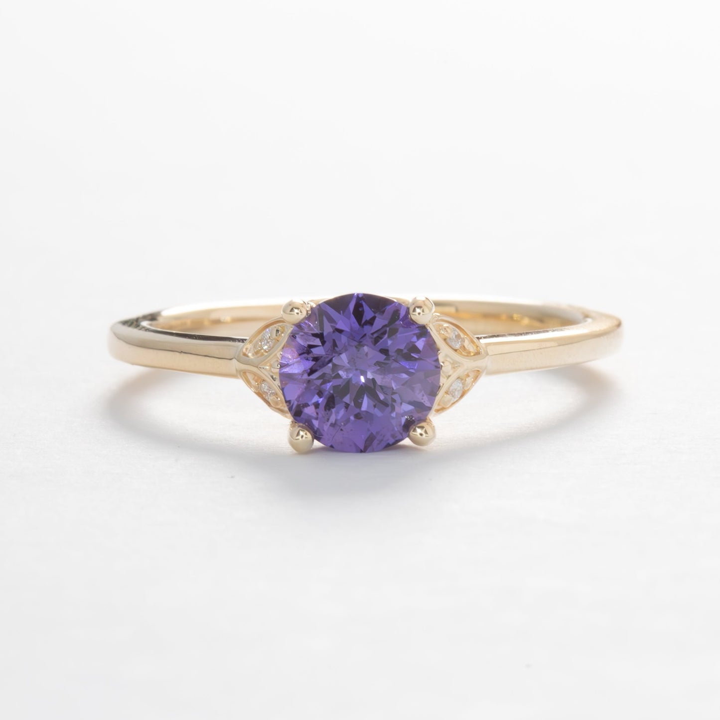 krystal engagement ring in yellow gold and purple lab sapphire