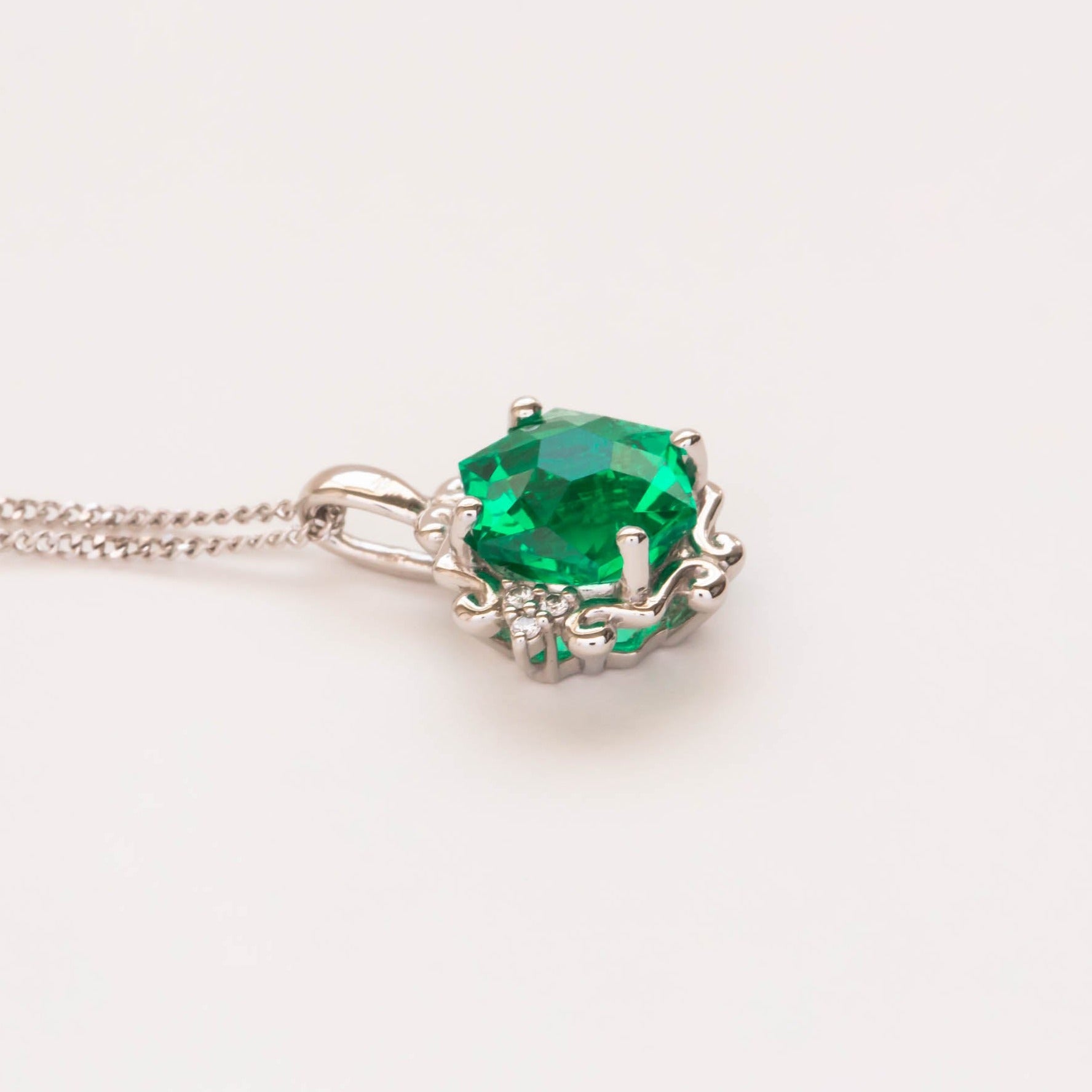 lab emerald hex cut pendant in platinum
