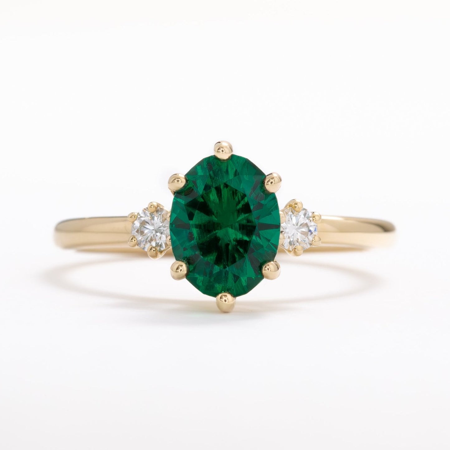 lab emerald oval three stone engagement ring
