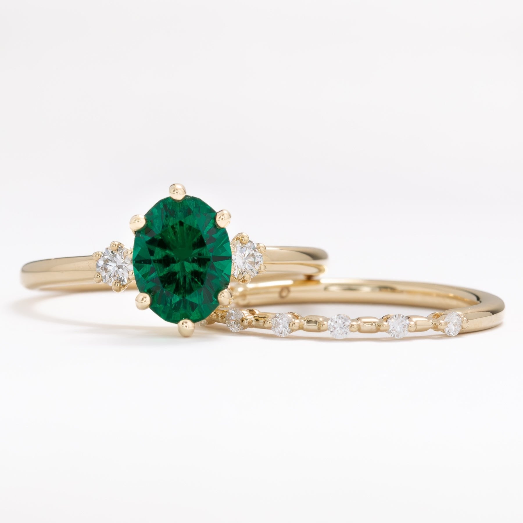 lab emerald oval three stone engagement ring