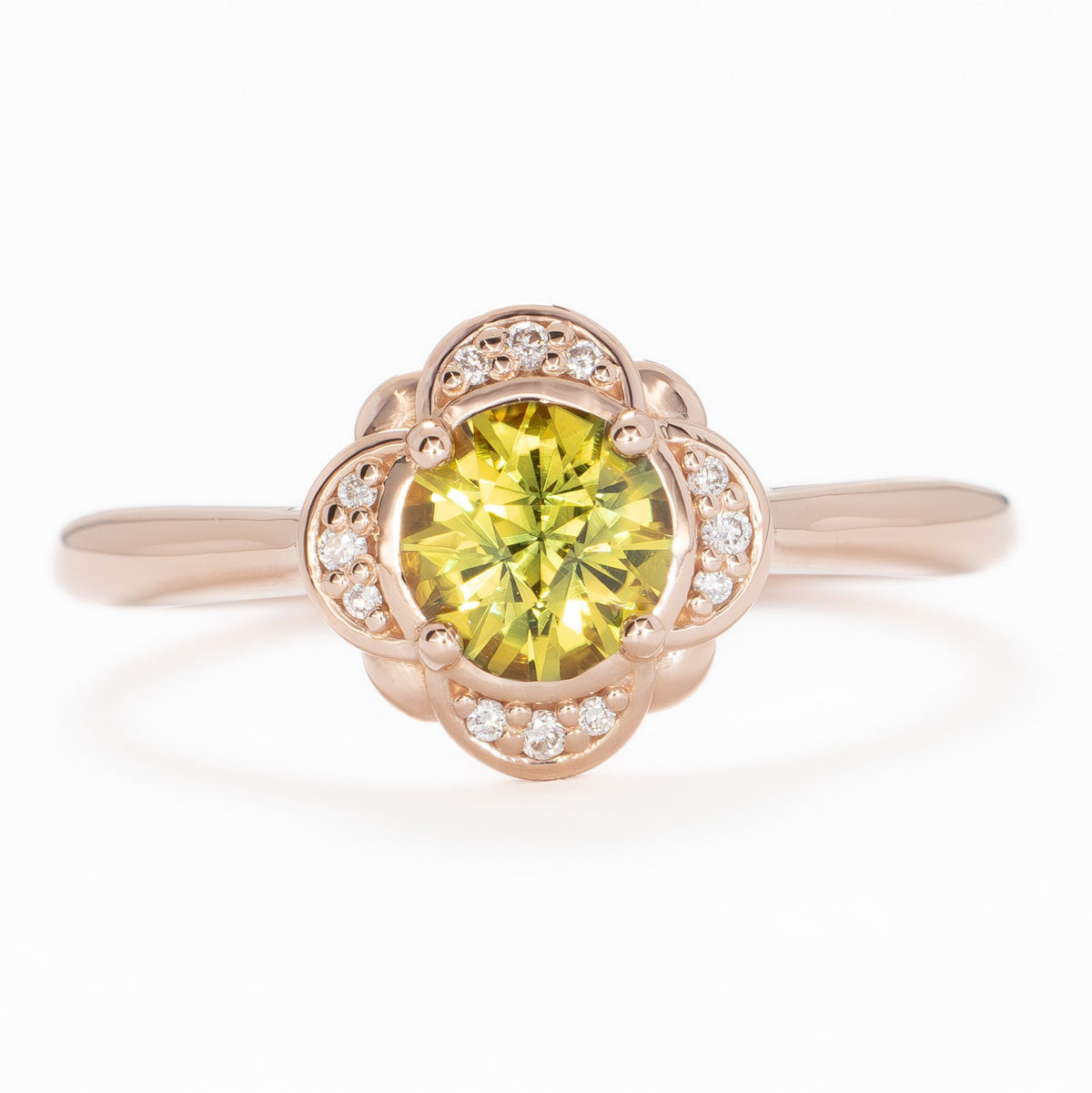 lalita art deco halo ring in rose gold with round yellow natural sapphire