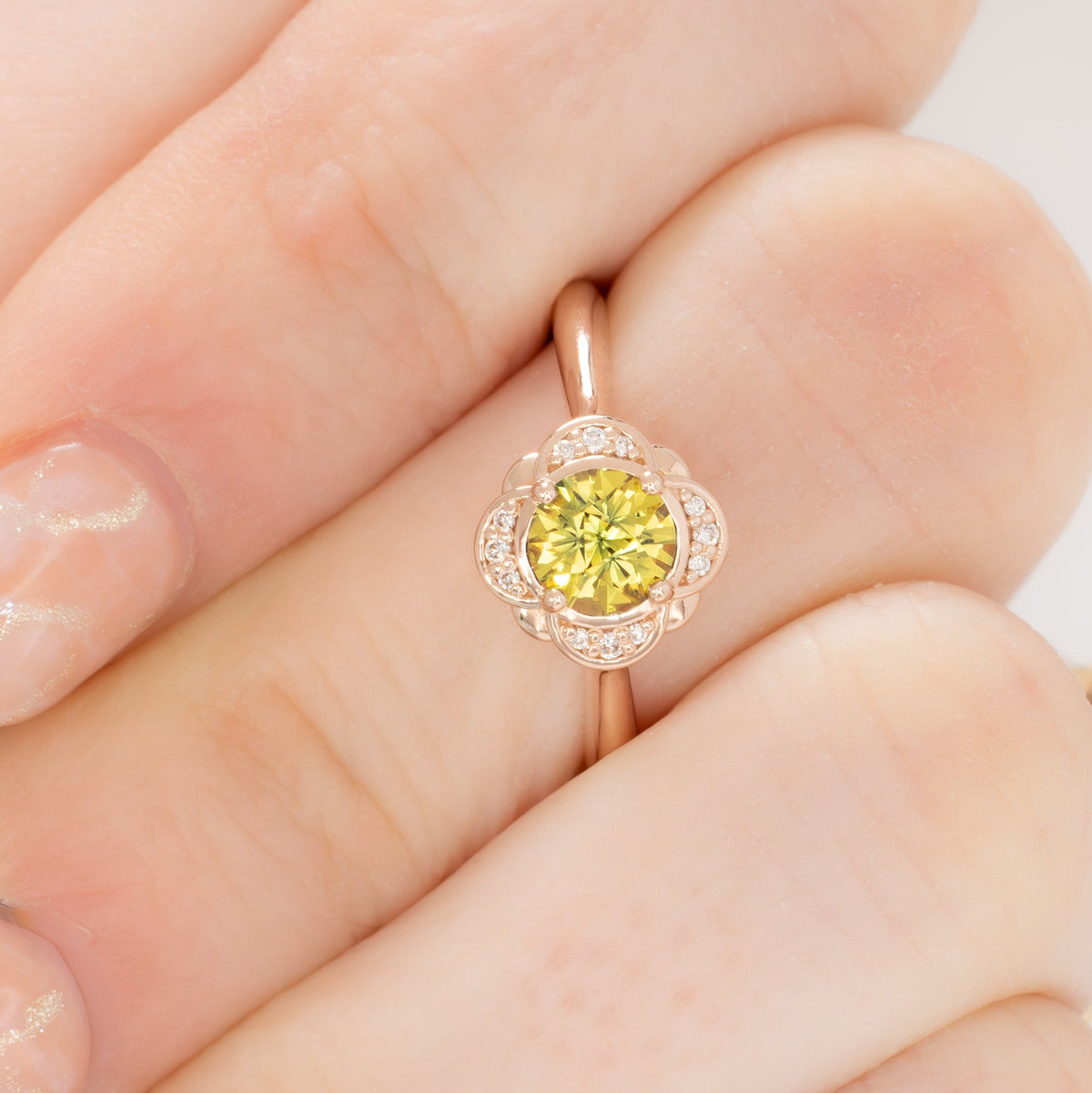 lalita art deco halo ring in rose gold with round yellow natural sapphire