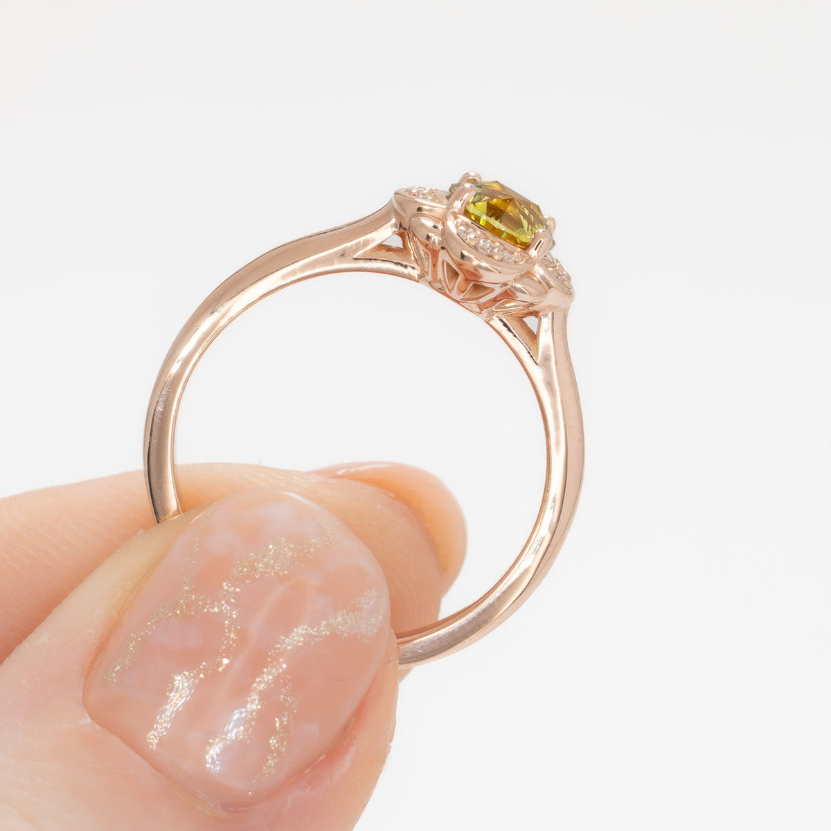 lalita art deco halo ring in rose gold with round yellow natural sapphire
