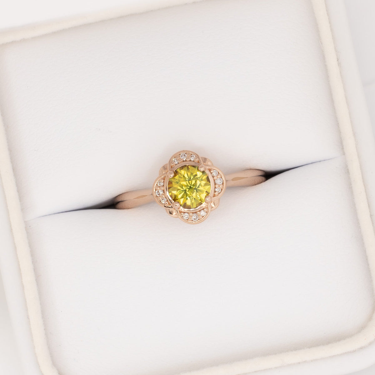 lalita art deco halo ring in rose gold with round yellow natural sapphire