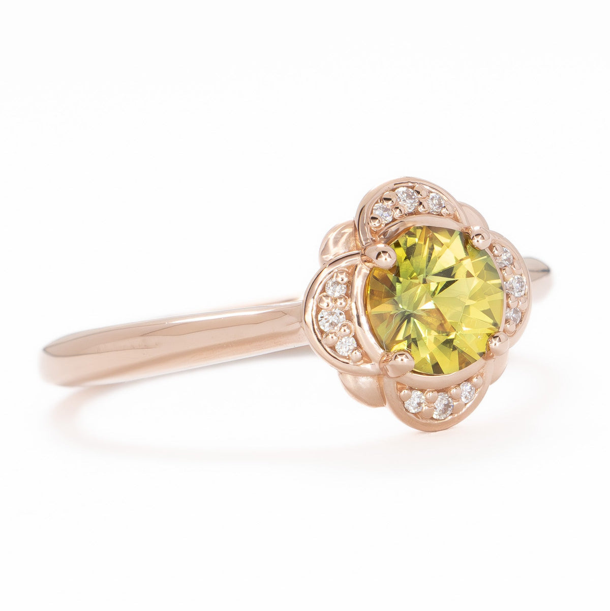 lalita art deco halo ring in rose gold with round yellow natural sapphire