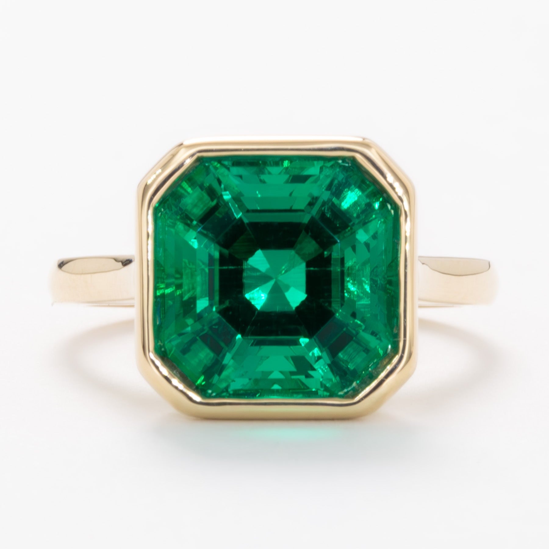 lessie bezel set solitaire with lab emerald asscher