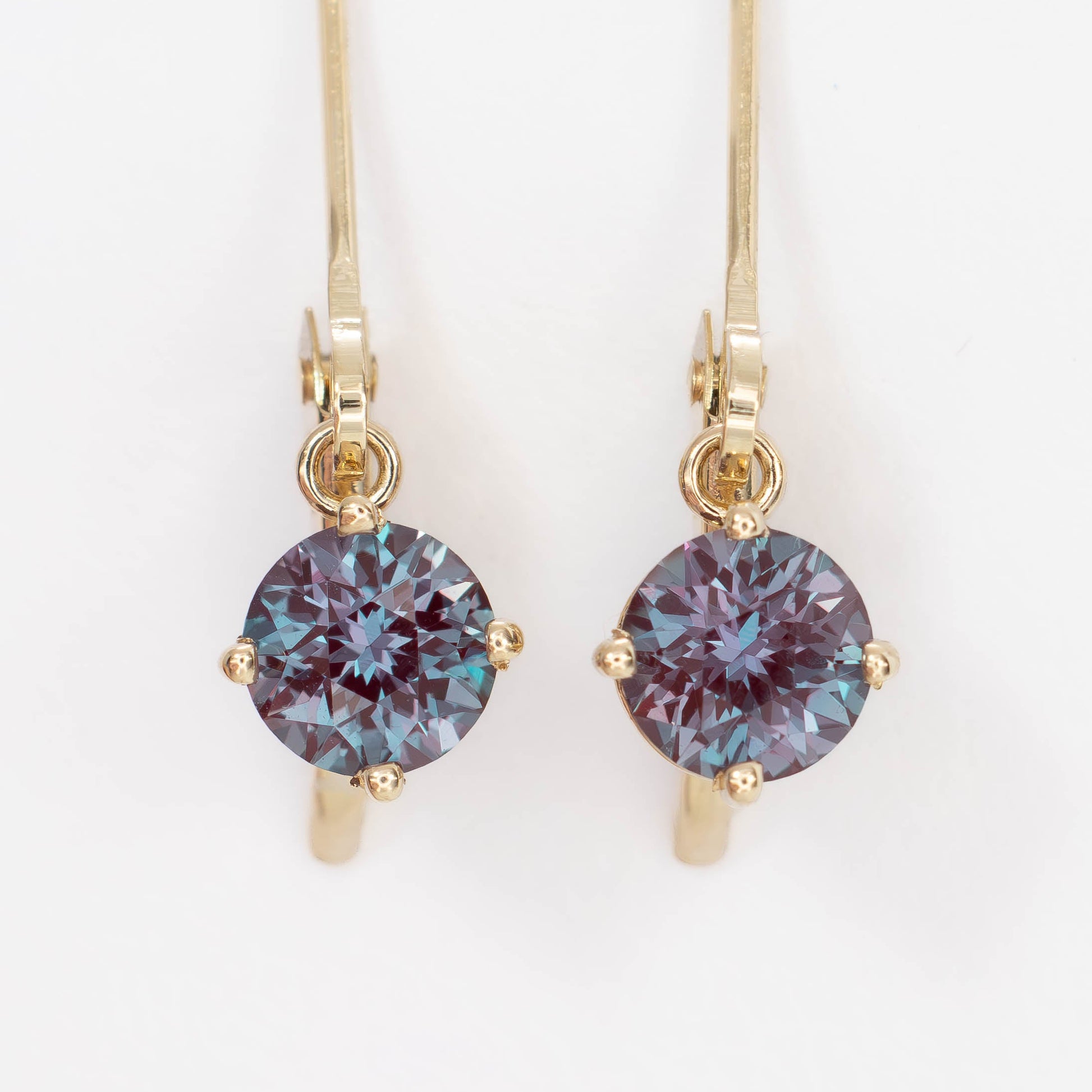 lever back earrings in yellow gold with round lab alexandrite