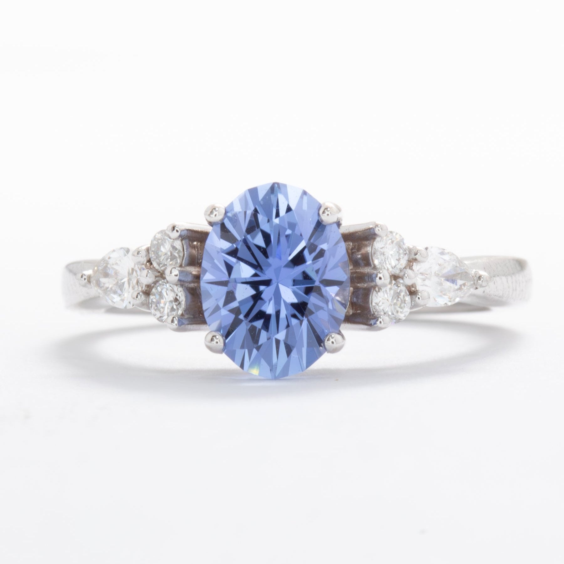 light blue oval engagement ring with lab diamonds